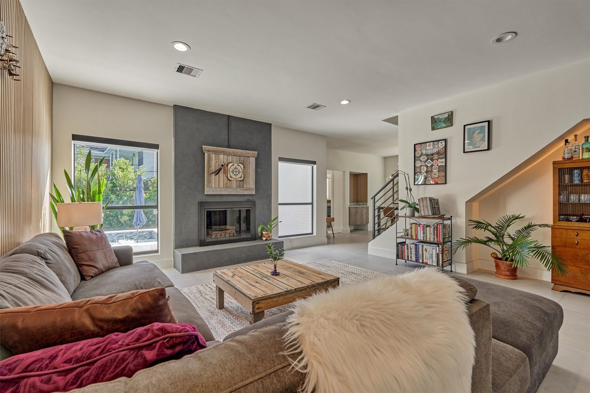 402 Susan Lane, Conroe, TX 77385 This reimagined den offers a cozy corner in which to relax or entertain around the fireplace.