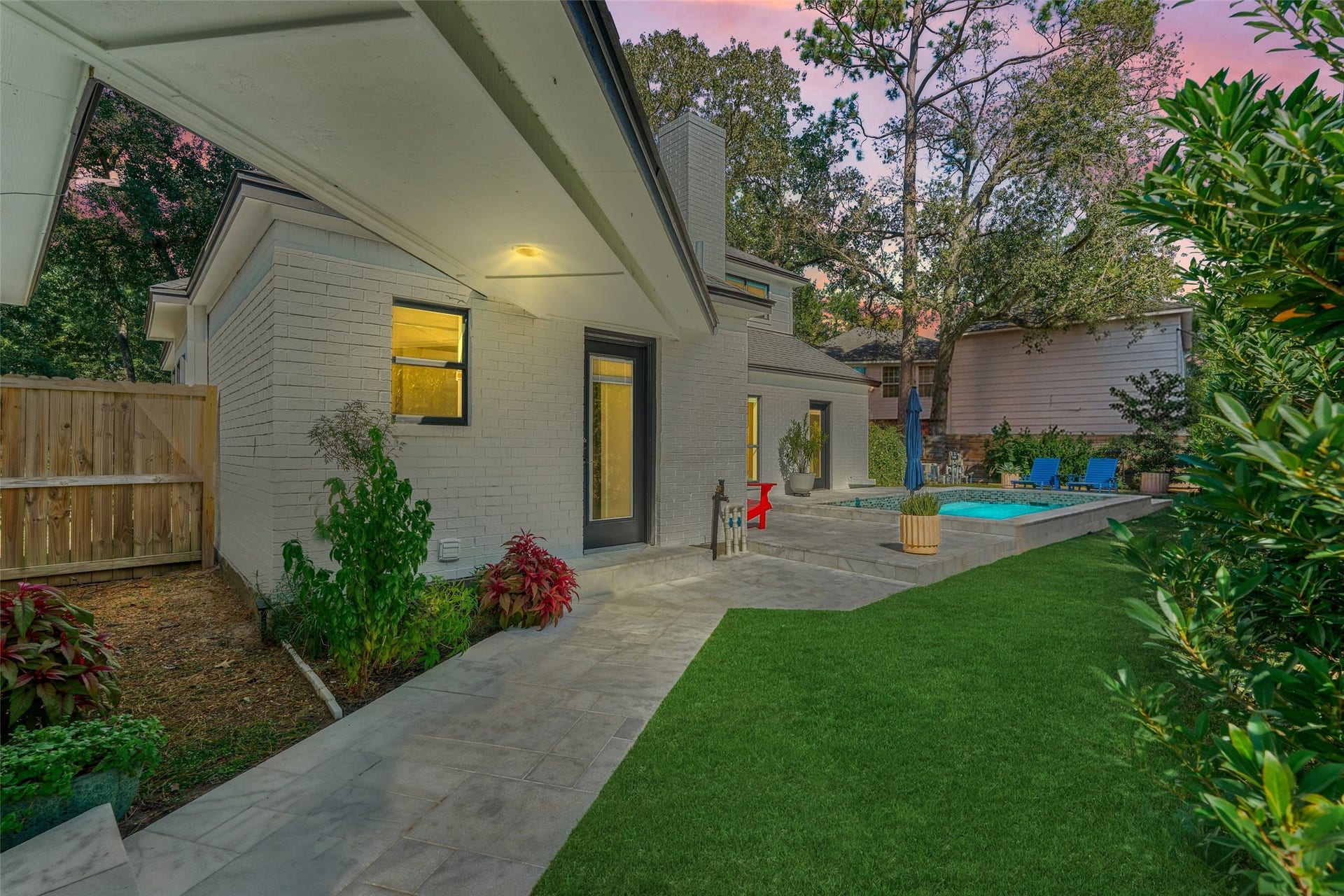 402 Susan Lane, Conroe, TX 77385 Covered walkway connects the backyard to the detached garage for protection from the elements. Sellers have added a new electrical panel and generator hook up here for added convenience.