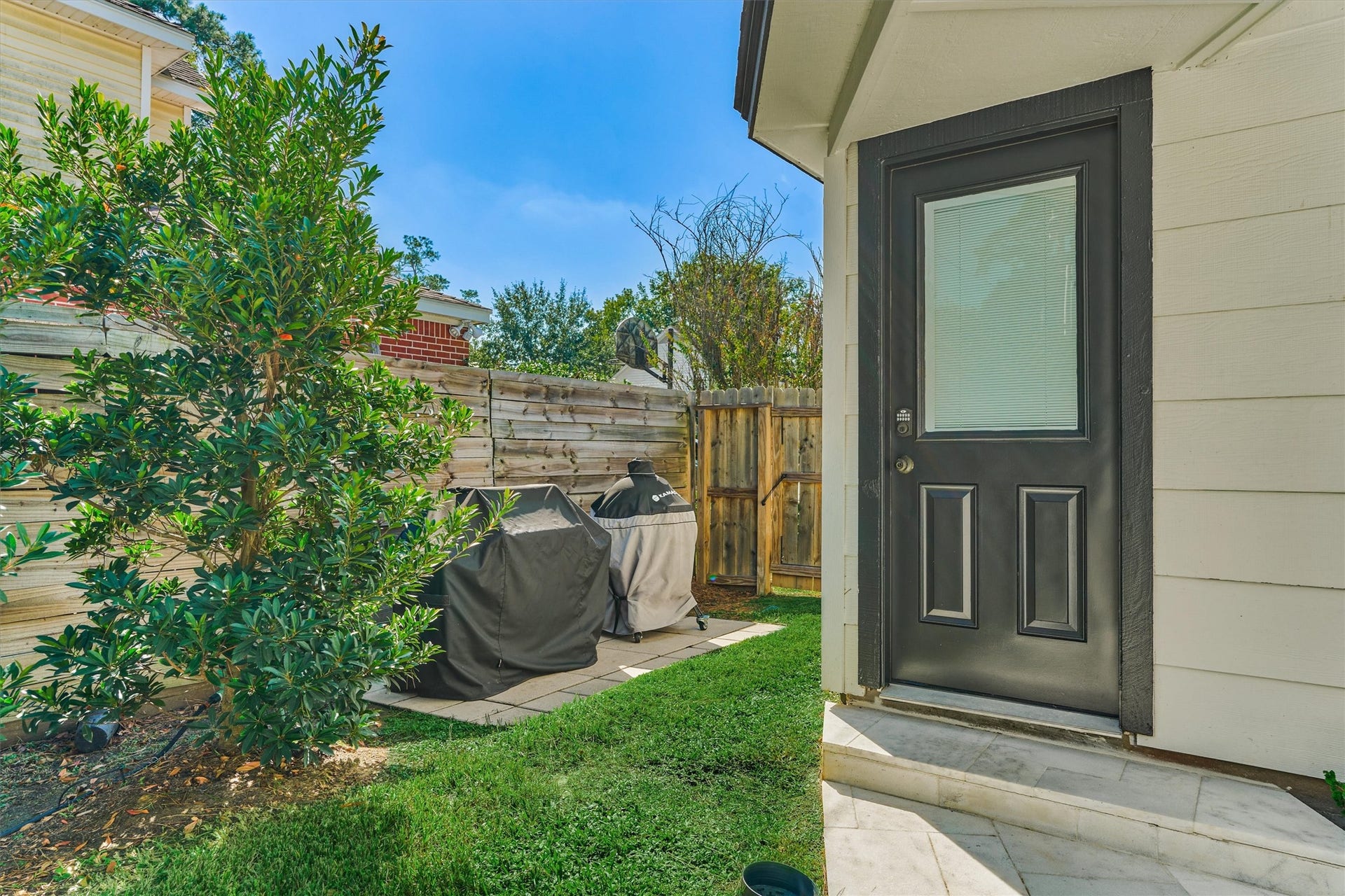 402 Susan Lane, Conroe, TX 77385 Improved BBQ pad sits just off the rear of the detached garage to make grilling a breeze!