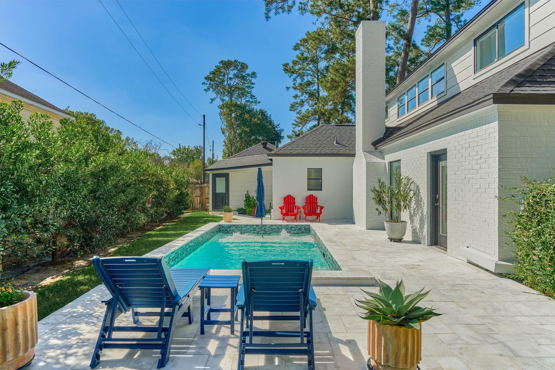 402 Susan Lane, Conroe, TX 77385 Recently painted exterior shines bright alongside the Travertine decking!
