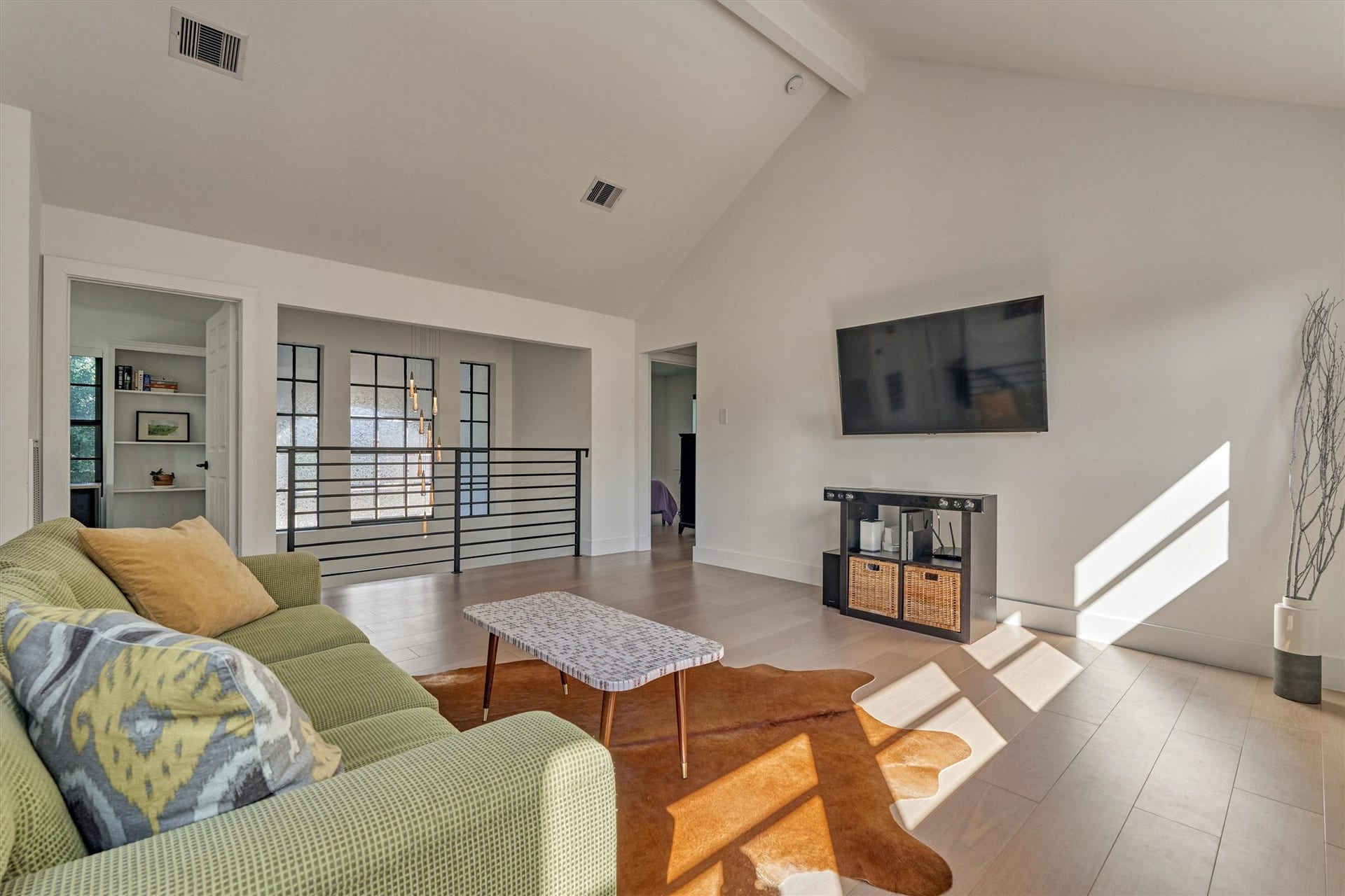 402 Susan Lane, Conroe, TX 77385 This flex space with vaulted ceiling could easily serve as a game/media room, home gym, or office. Note the custom chandelier which hangs in the two-story foyer!