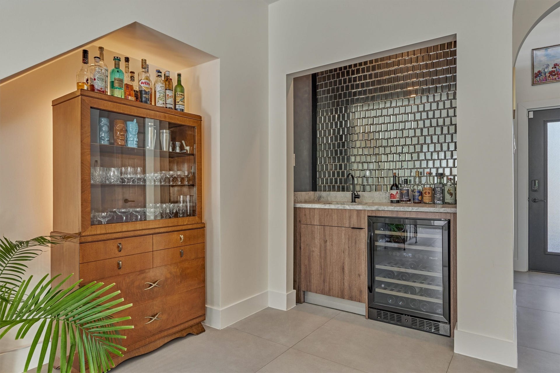 402 Susan Lane, Conroe, TX 77385 Every space has been maximized for use with smart storage solutions. Wet bar area in the den features built in dual zone wine chiller and striking glass tile backsplash.