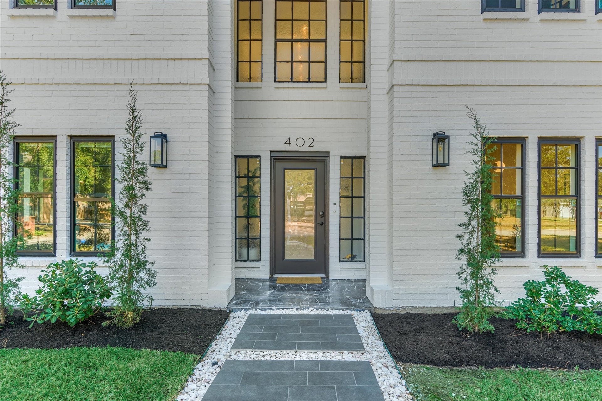 402 Susan Lane, Conroe, TX 77385 Stone walkway, black marble entry, and recent roof ('22) add to the extreme curb appeal of this home!