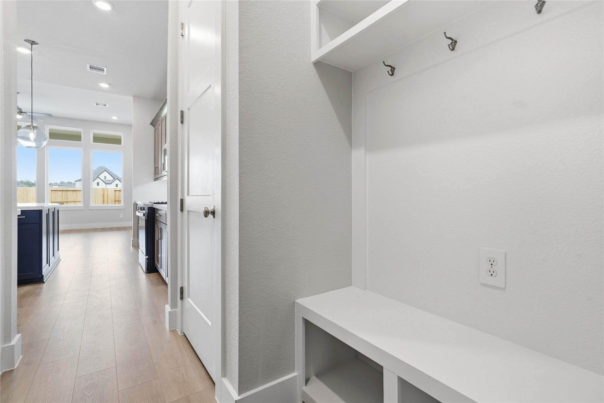 The ultimate in organization and cleanlinessa dedicated mudroom designed to manage daily life with ease. This highly desirable space serves as the perfect "drop zone" between the outdoors and your main living areas, helping to keep your home tidy and clutter-free.