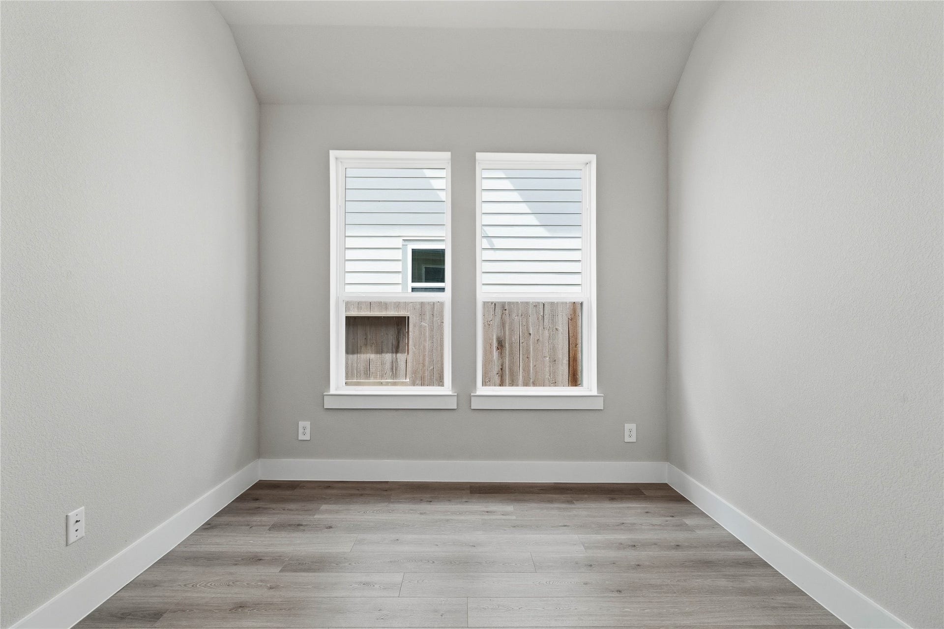 The Study provides the quiet retreat necessary for a productive home office, eliminating the daily commute and maximizing work-from-home efficiency. It features French doors, neutral toned walls, and large windows.