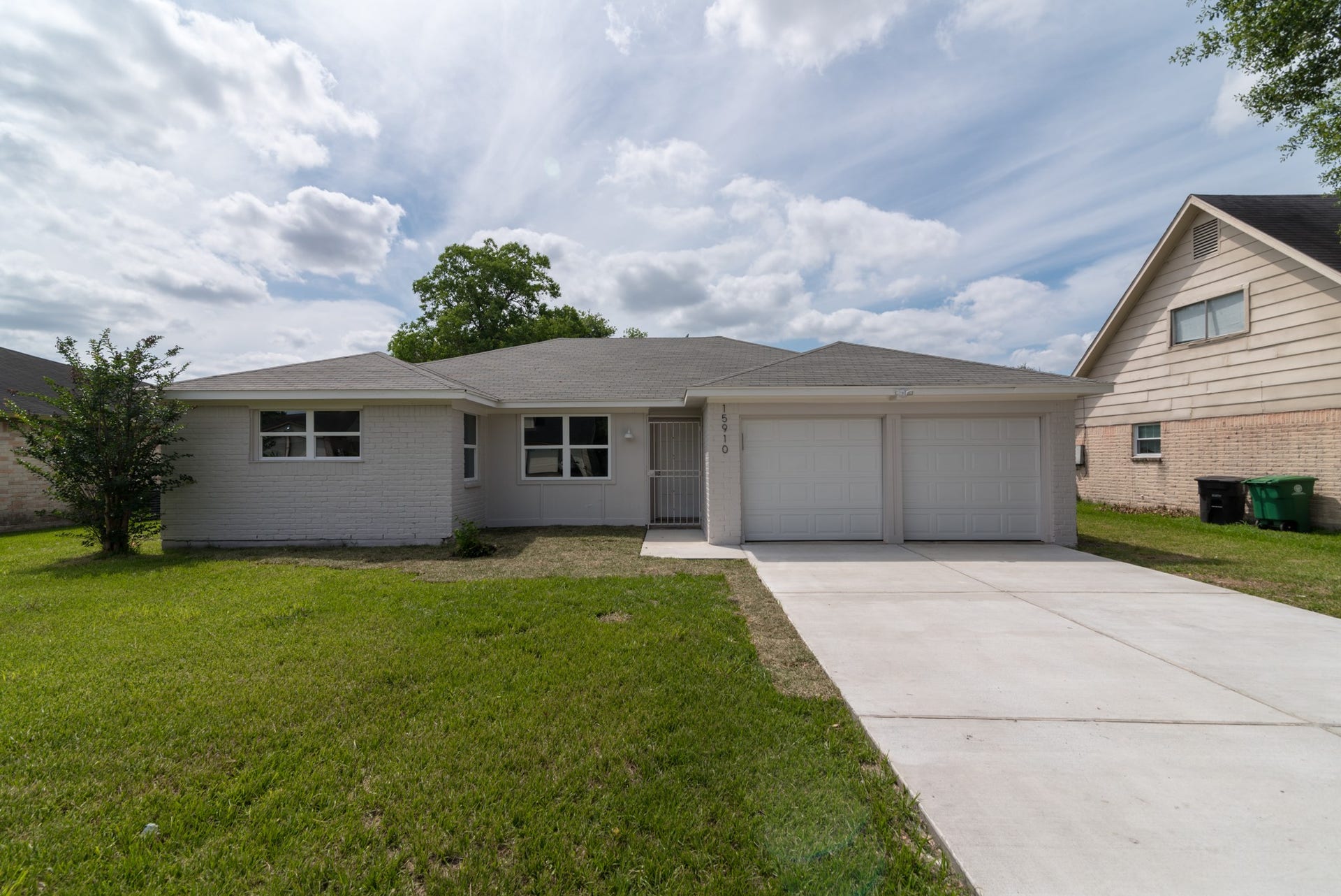 15910 Plagens Lane, Missouri City, TX 77489 Charming one-story home featuring a spacious two-car garage, a well-maintained lawn, and a welcoming brick exterior, perfect for comfortable living.