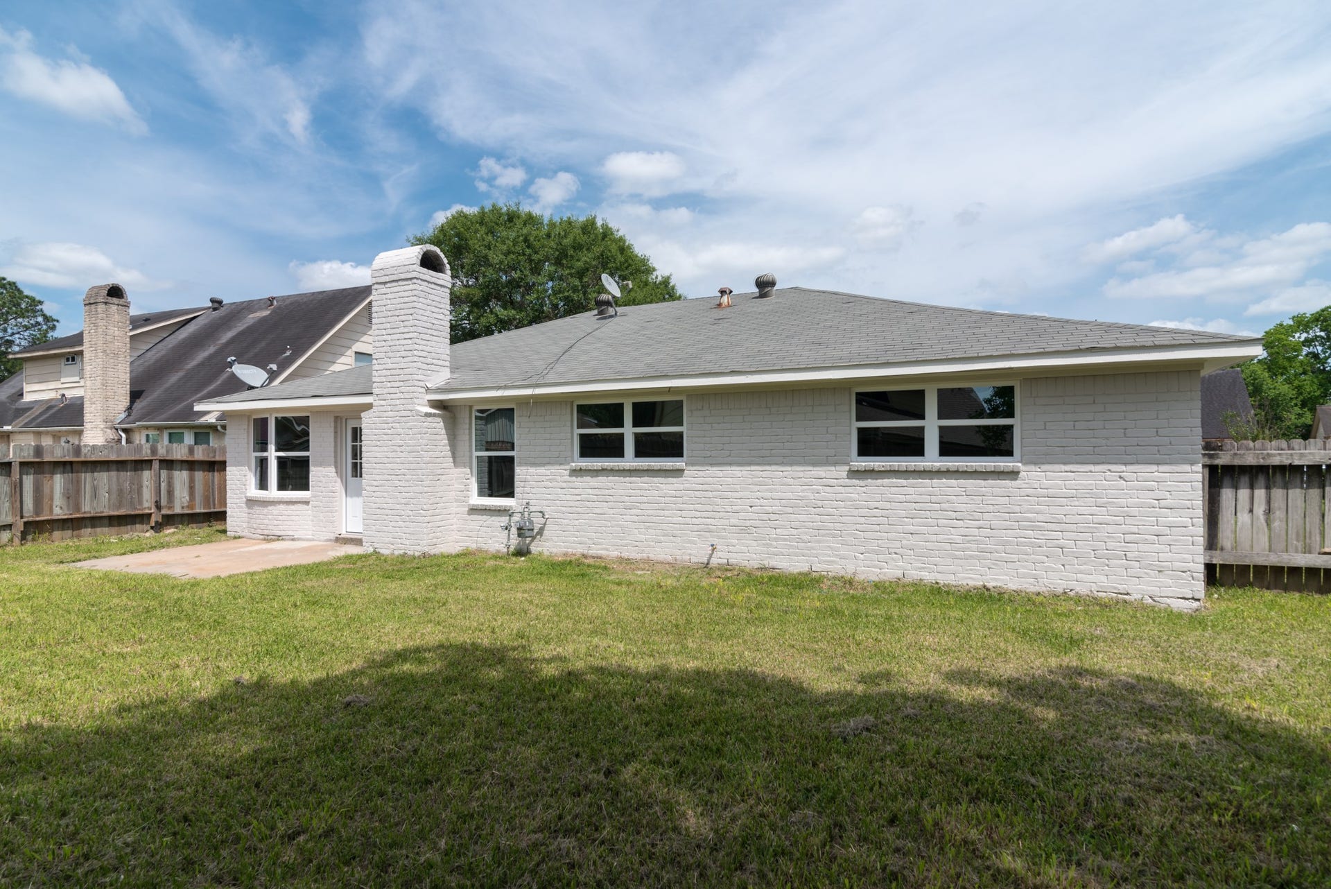 15910 Plagens Lane, Missouri City, TX 77489 Charming single-story home with a spacious backyard, ideal for outdoor entertaining, featuring a classic brick exterior and ample windows for natural light.