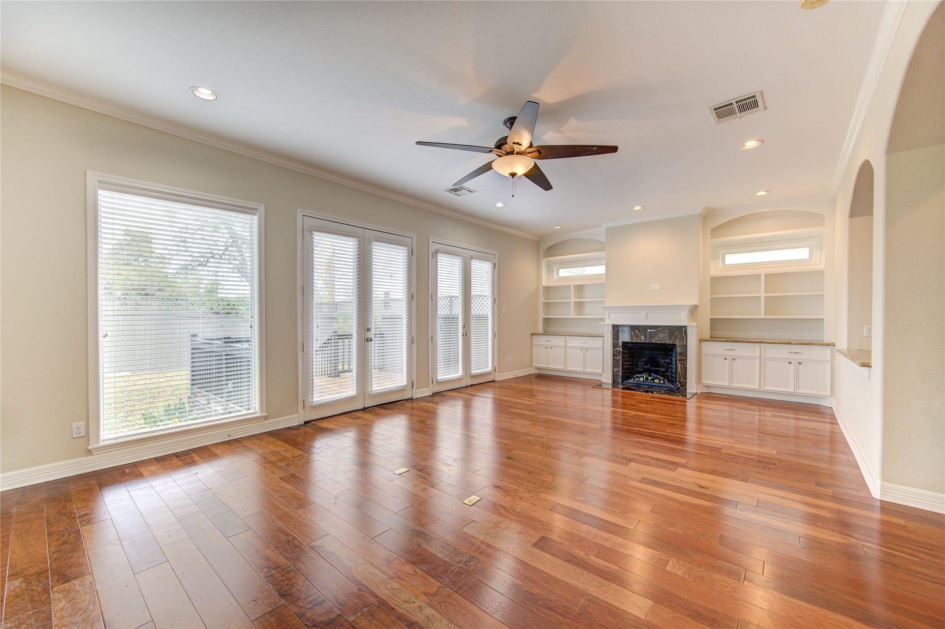 Spacious family room offering plenty of room for comfortable seating and entertaining.