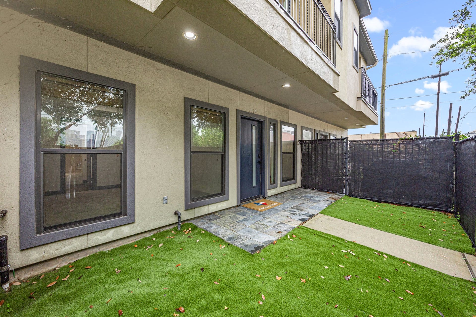 1119 Saint Charles Street, Houston, TX 77003 Front yard turfed with privacy screens