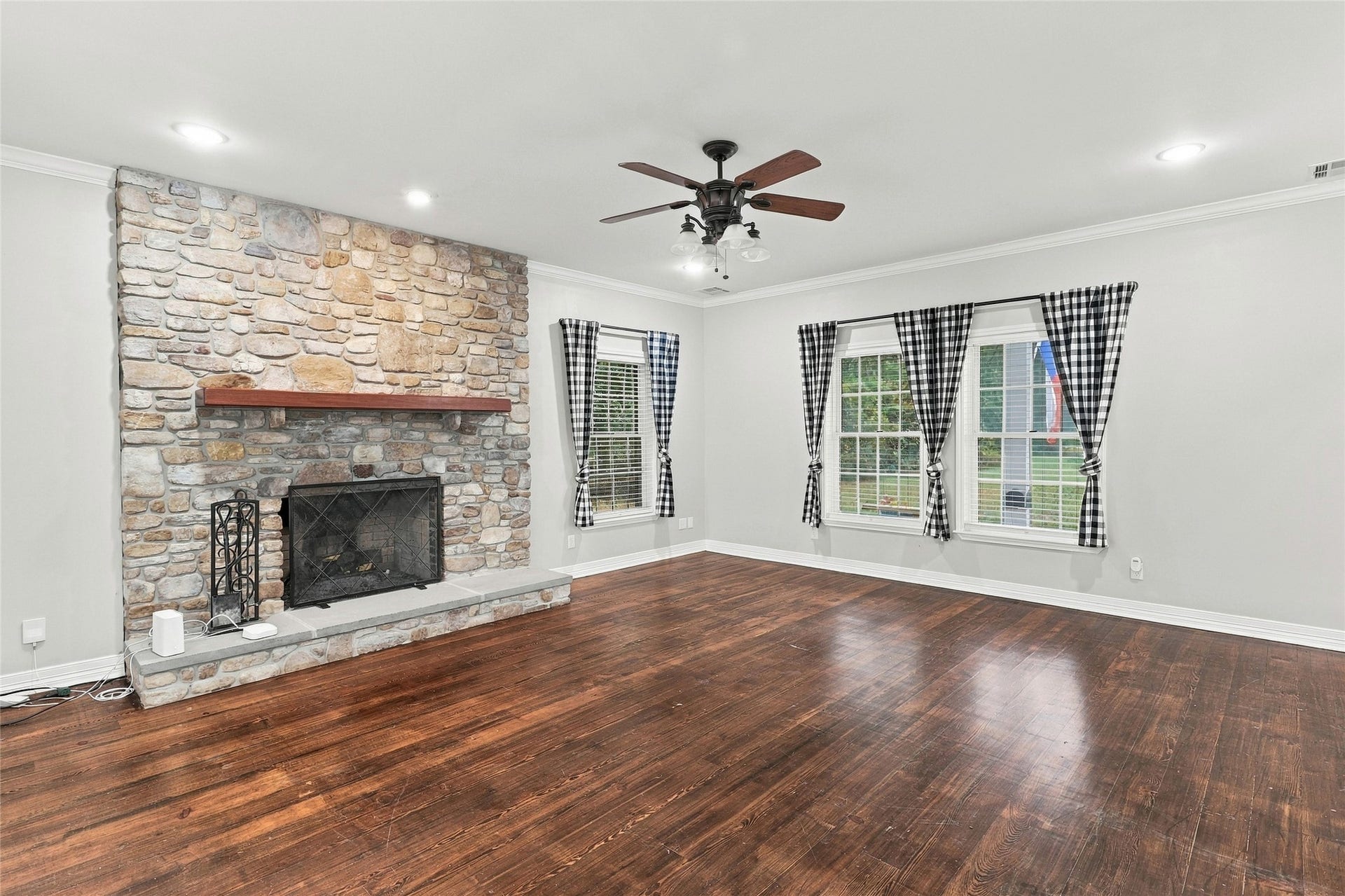 8714 Holly Hills Drive, Tomball, TX 77375 Check out this cozy family room centered around a stunning stone fireplace.