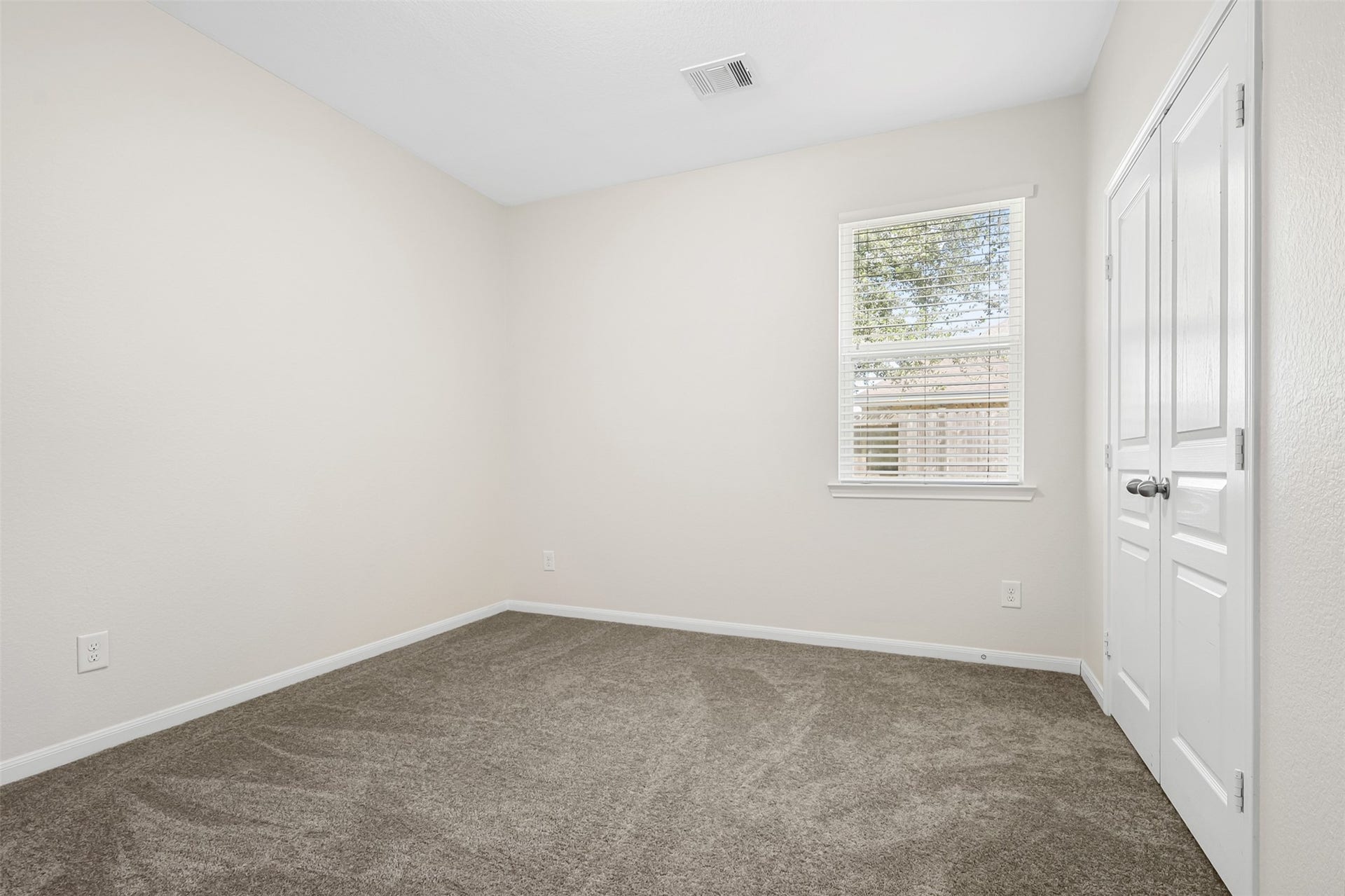 9731 Carina Forest Court, Humble, TX 77396 This additional bedroom offers plenty of flexibility and room to grow, with soft carpeting, a ceiling fan, and a comfortable layout that can easily accommodate bedroom furniture, a desk, or a cozy reading corner.