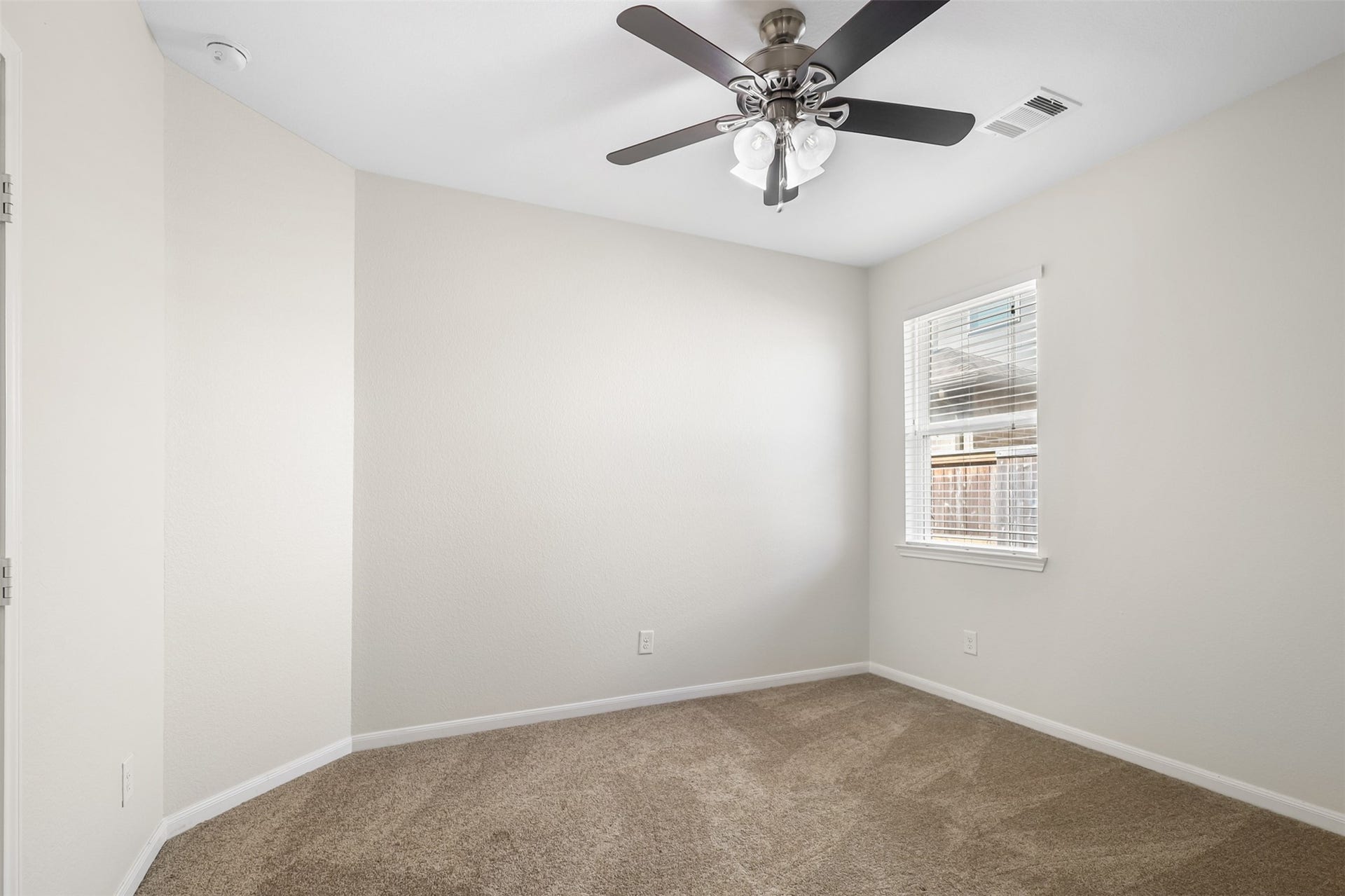 9731 Carina Forest Court, Humble, TX 77396 Two secondary bedrooms are to the left of living room is bright, comfortable, and ready to take on whatever role fits your lifestyle.