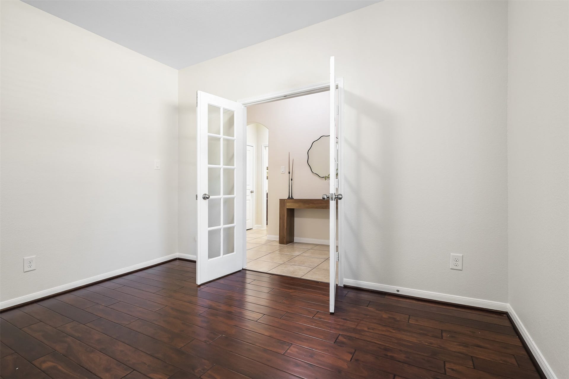 9731 Carina Forest Court, Humble, TX 77396 The second view highlights the room's flexibility and polished details, including the beautiful wood flooring and French-door entry. With plenty of open wall space, this room can easily become a home office, library, creative space, or quiet retreat.