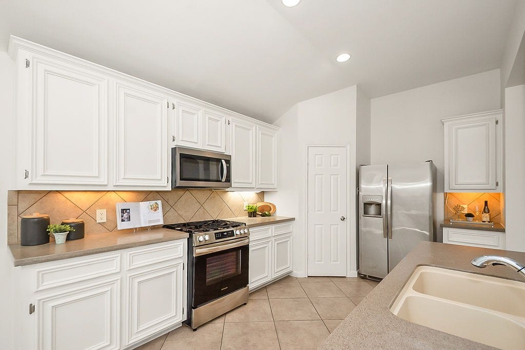 14903 Meridian Park Lane, Humble, TX 77396 Additional view of the kitchen with the above range microwave and gas range.
