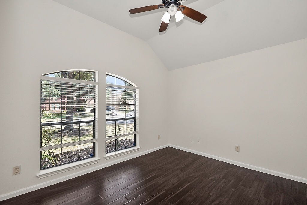 14903 Meridian Park Lane, Humble, TX 77396 This secondary bedroom is in the front of the house of this split floorplan.