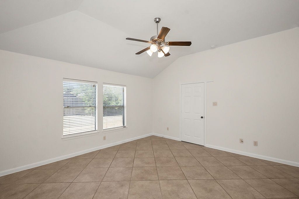 14903 Meridian Park Lane, Humble, TX 77396 The primary bedroom is accessed from the living room and is quite spacious, as is the closet.