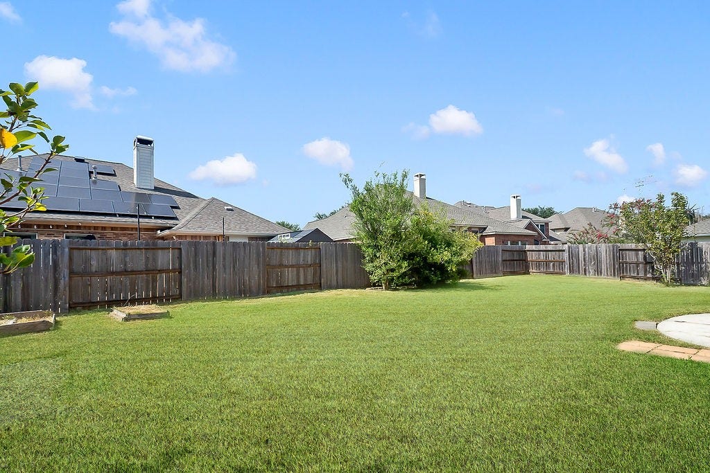 14903 Meridian Park Lane, Humble, TX 77396 The backyard is expansive and awaits your personal preferences.