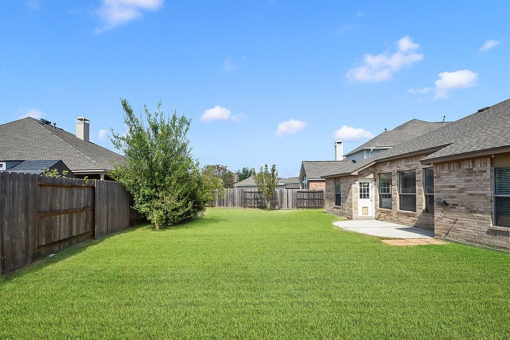 14903 Meridian Park Lane, Humble, TX 77396 This yard is spacious enough for a pool and playscape.
