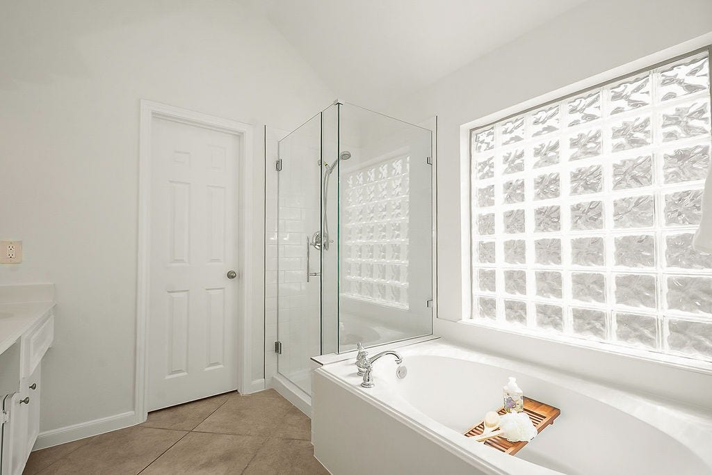 14903 Meridian Park Lane, Humble, TX 77396 The shower has recently been upgraded with a new shower pan, new subway tile, and new showerhead and glass door.