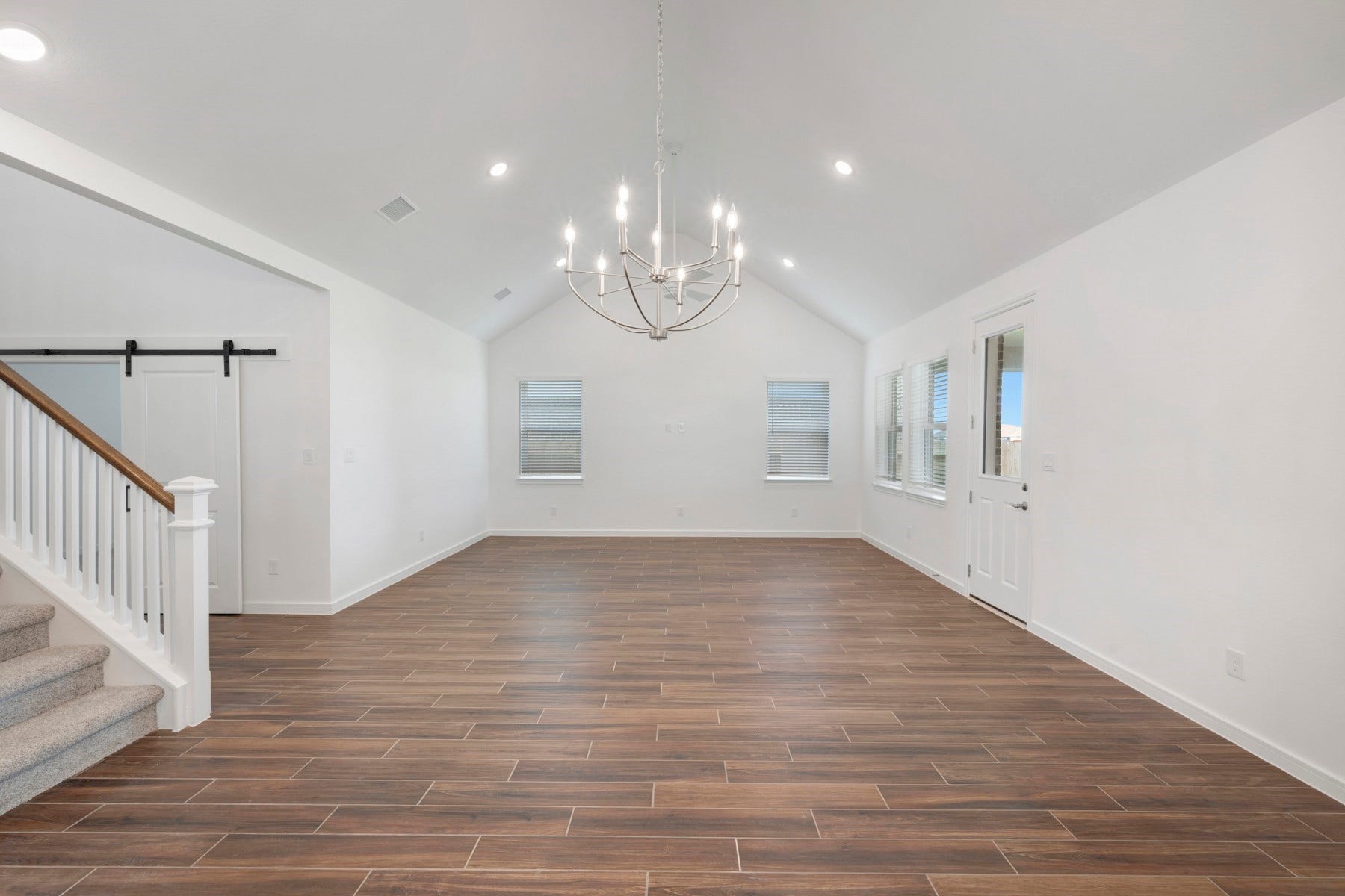 Open living area with vaulted ceilings (*Photo not of actual home and used for illustration purposes only.)