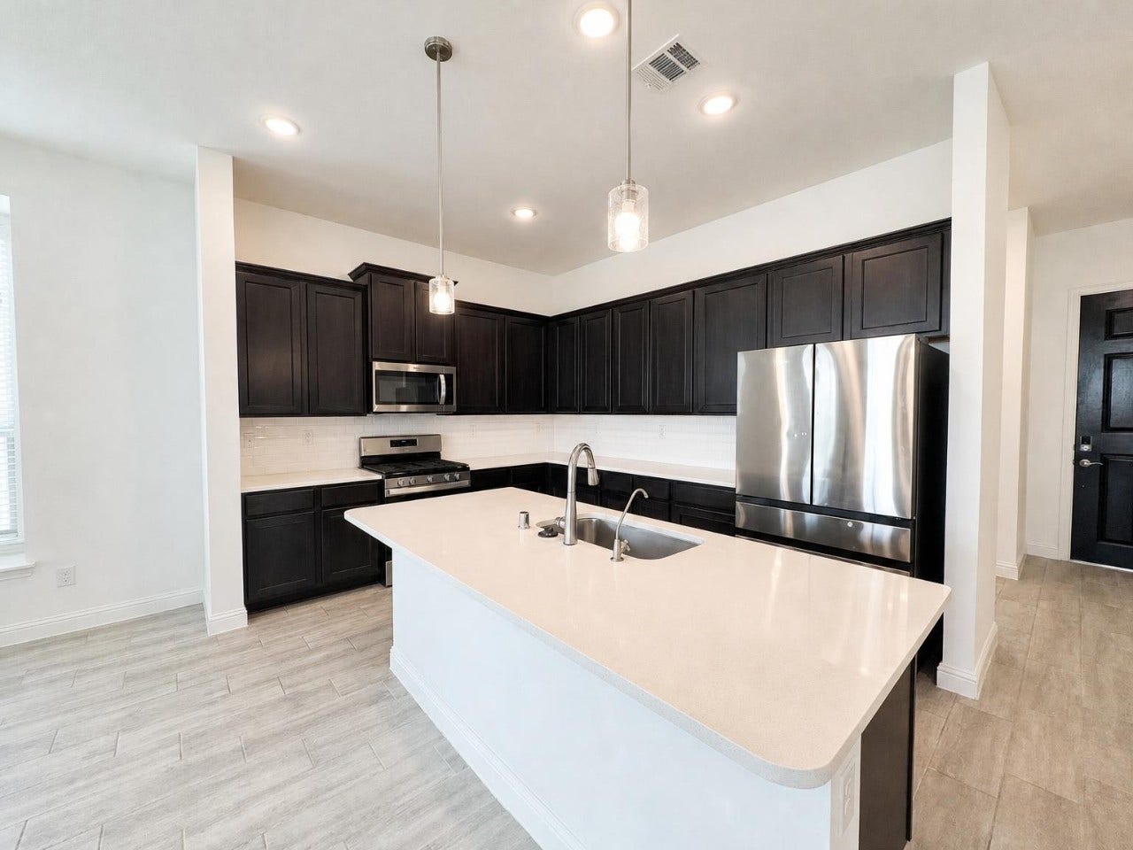 2004 Terra Rose Drive, Katy, TX 77493 The kitchen includes 3CM quartz counters, 42" cabinets, and a large island.