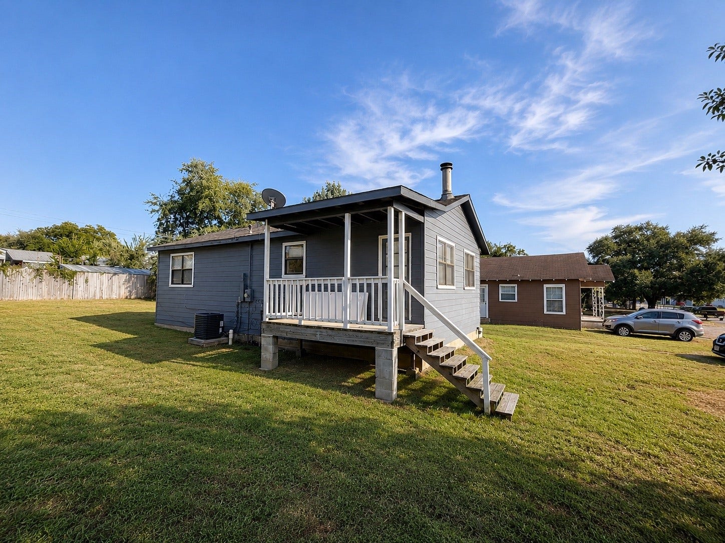 Covered Back Porch Overlooking the Open Yard