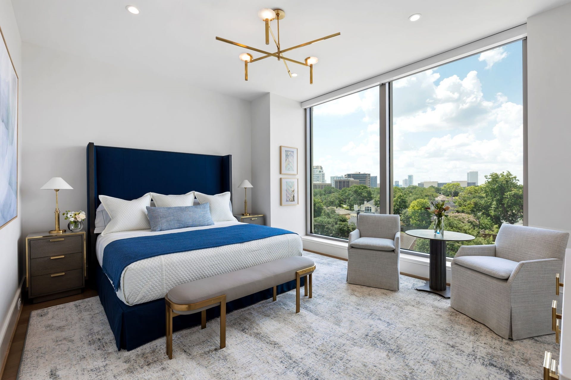 5656 San Felipe Street, #1005, Houston, TX 77056 Expansive primary bedroom bathed in natural light from Southern-facing windows. Photos are of a similar unit with the same floor plan