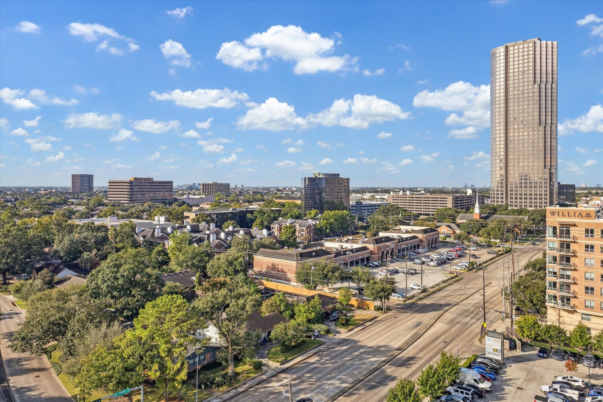 5656 San Felipe Street, #1005, Houston, TX 77056 Expansive city skyline views featuring sweeping vistas of high-rise buildings and surrounding urban landscape. Photos are of a similar unit with the same floor plan