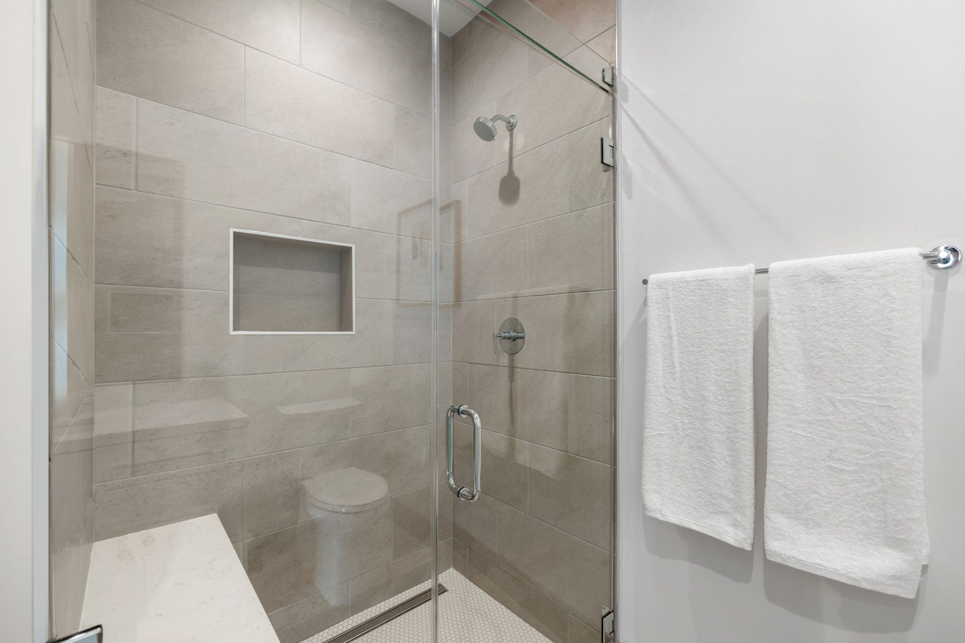 5656 San Felipe Street, #1005, Houston, TX 77056 Alternate view of the guest bathroom featuring a glass enclosed walk-in showe. Photos are of a similar unit with the same floor plan
