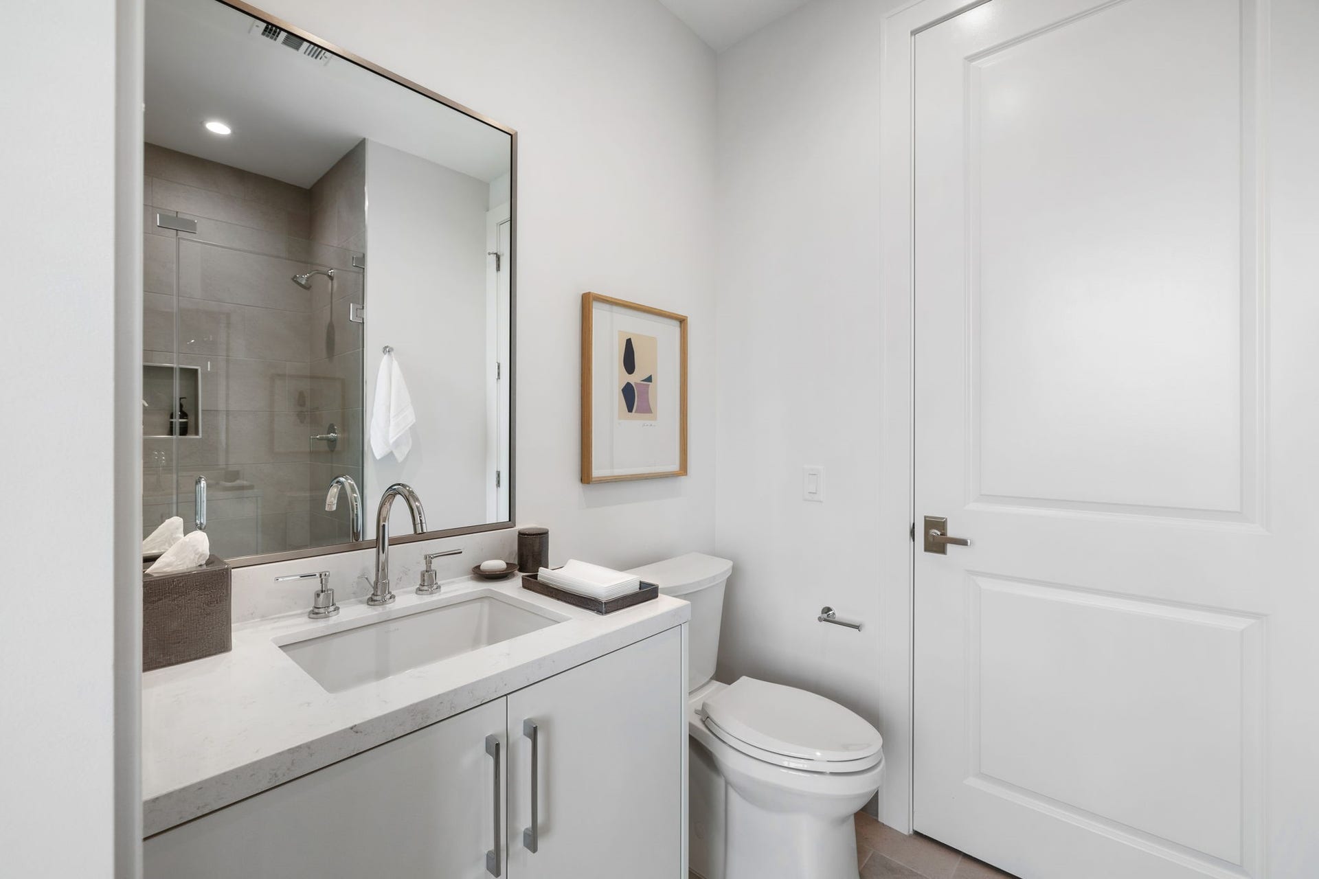 5656 San Felipe Street, #1005, Houston, TX 77056 En-suite secondary guest bathroom with walk-in shower and beautiful quartz counter-top. Photos are of a similar unit with the same floor plan