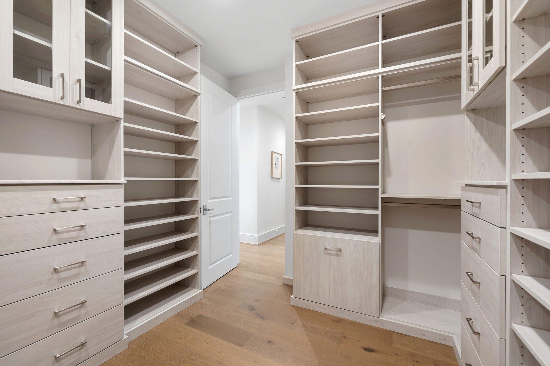 5656 San Felipe Street, #1005, Houston, TX 77056 Upgraded, custom-built Primary closet. Photos are of a similar unit with the same floor plan