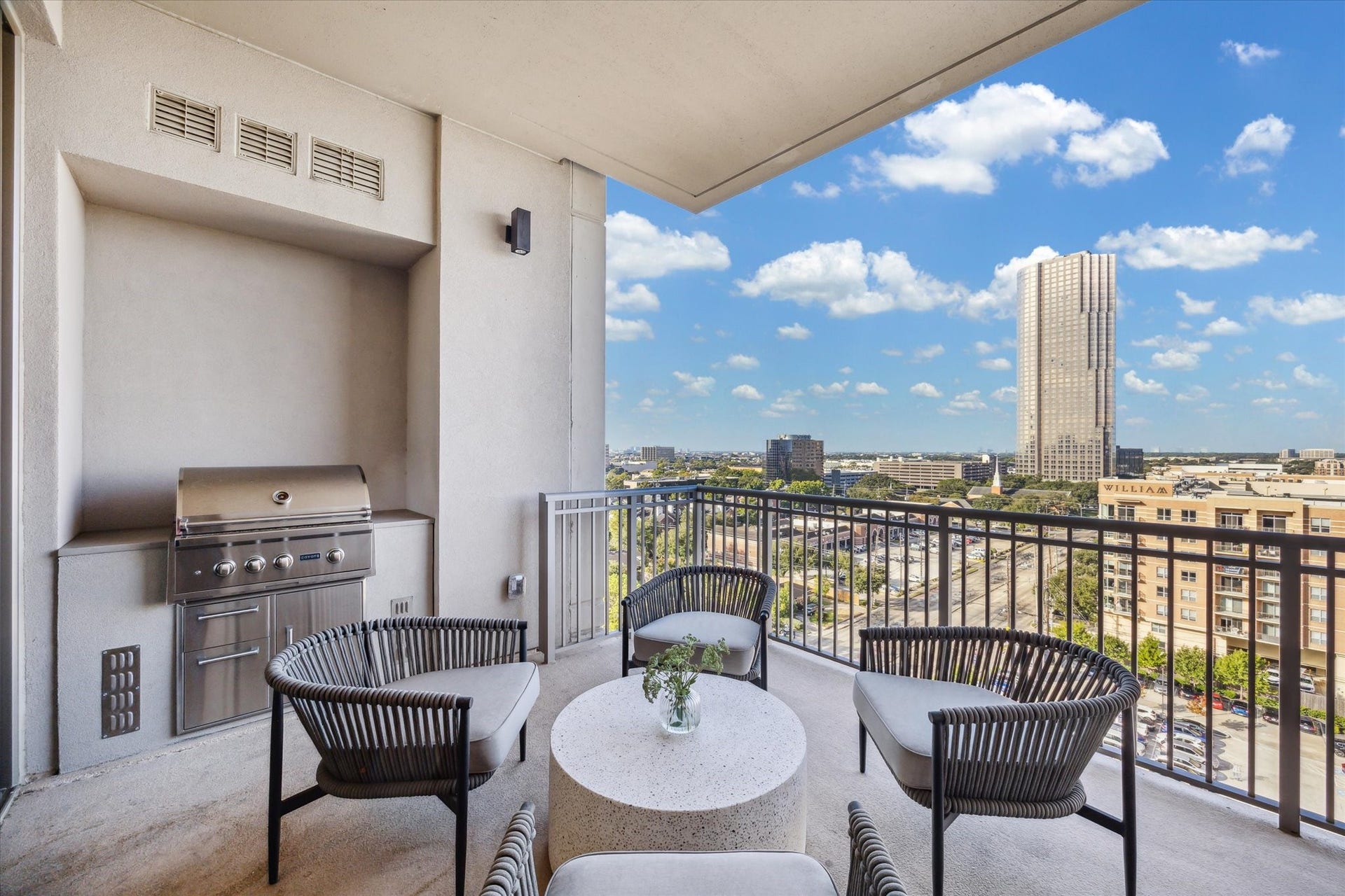 5656 San Felipe Street, #1005, Houston, TX 77056 Spacious balcony featuring an upgraded built-in grill and sweeping city skyline views. Photos are of a similar unit with the same floor plan