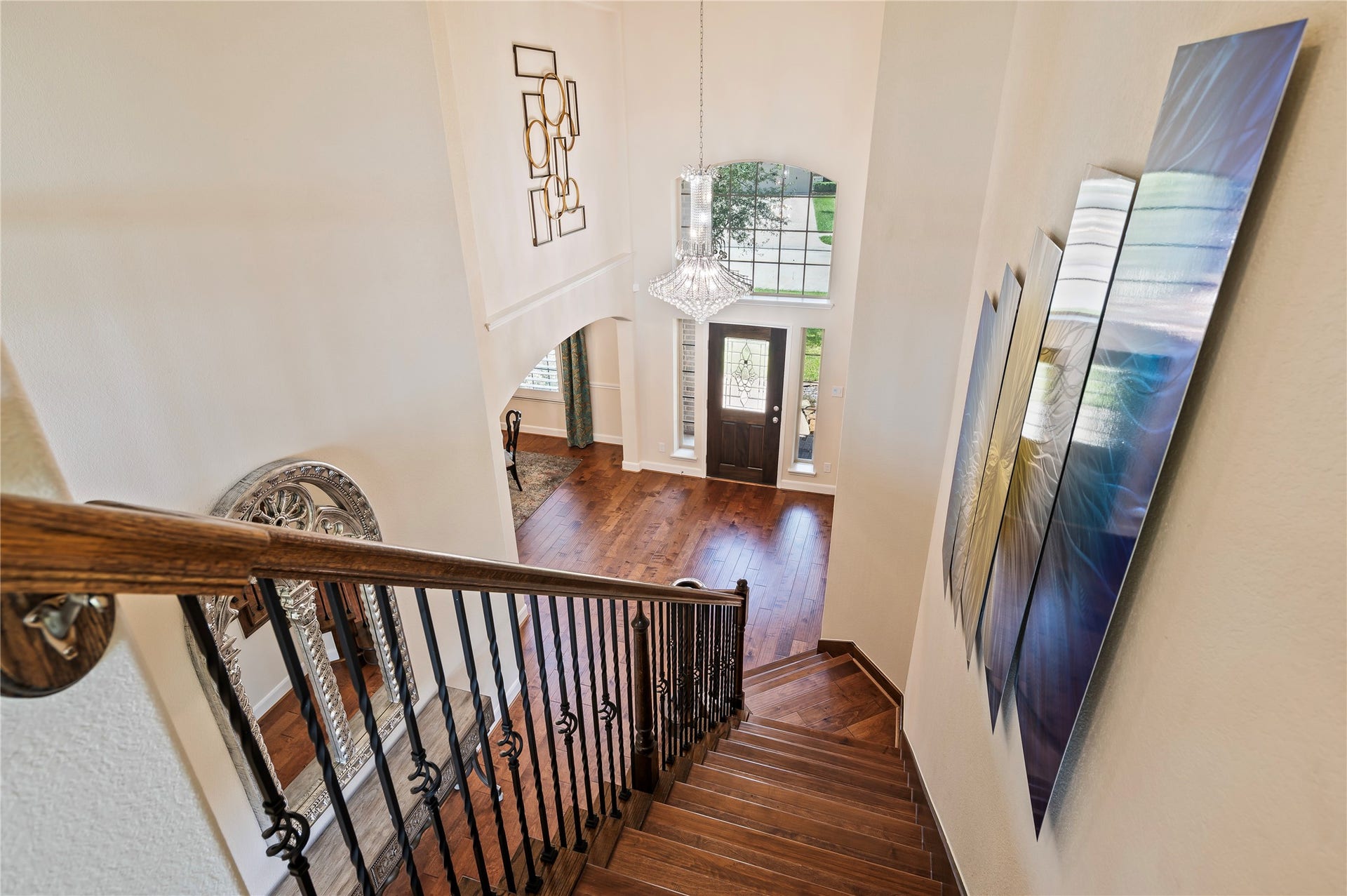 2322 Ashley Falls Lane, League City, TX 77573 Hardwood floors grace the stairway leading to the 2nd level featuring wrought iron spinals,