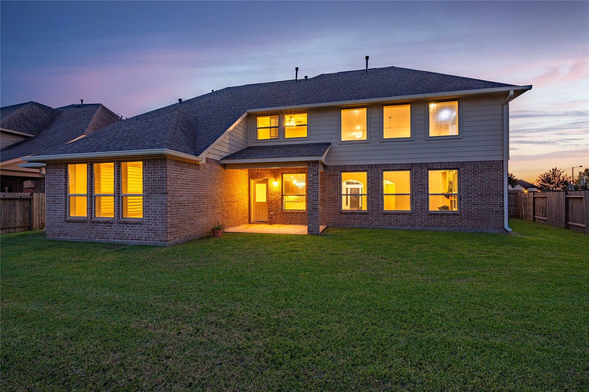 2322 Ashley Falls Lane, League City, TX 77573 Pool-size back yard is fully fenced while the home features full brick on all four sides, gutters and covered back patio.