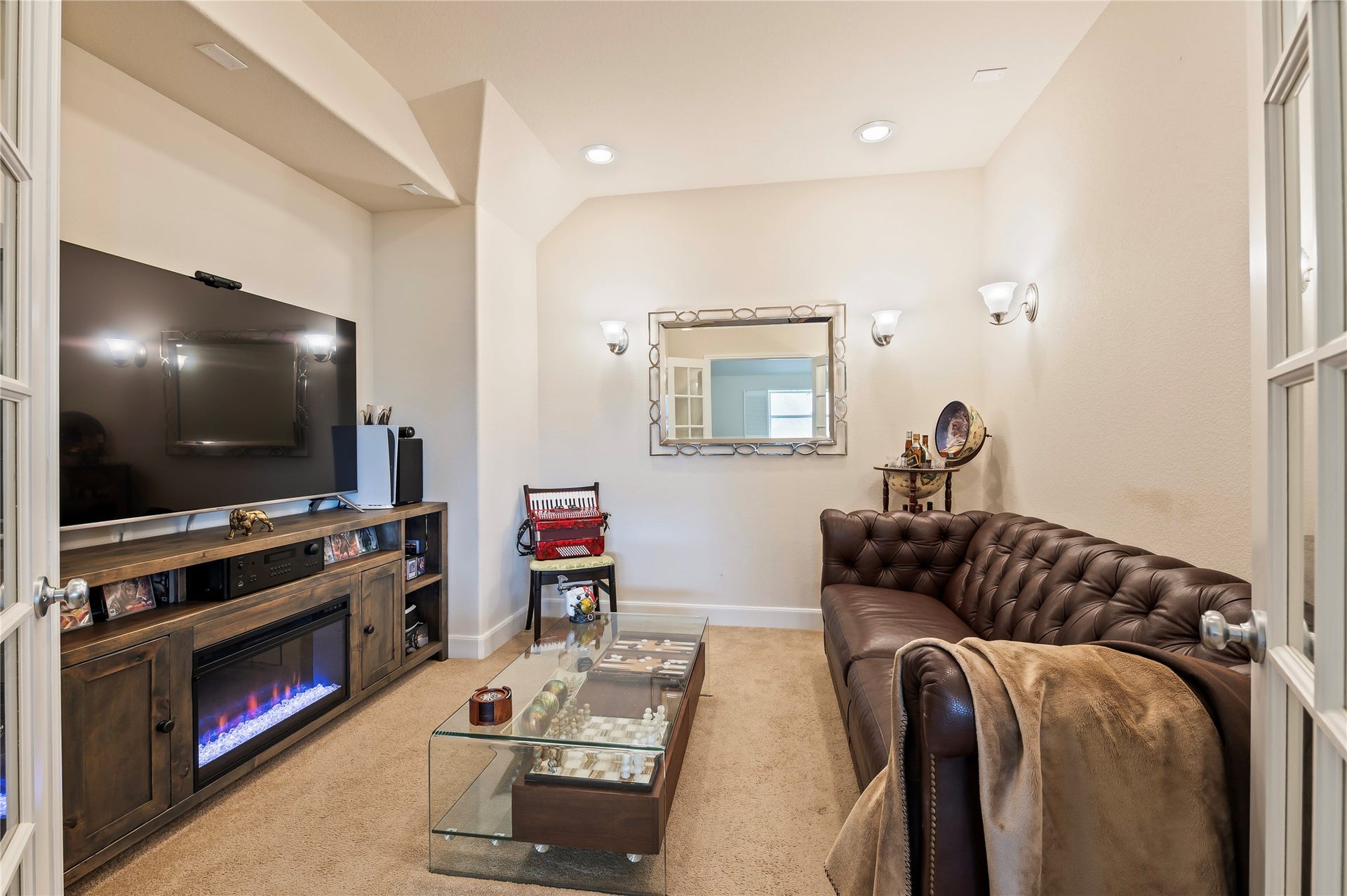 2322 Ashley Falls Lane, League City, TX 77573 Media room features French doors and 5.1 surround sound wiring.