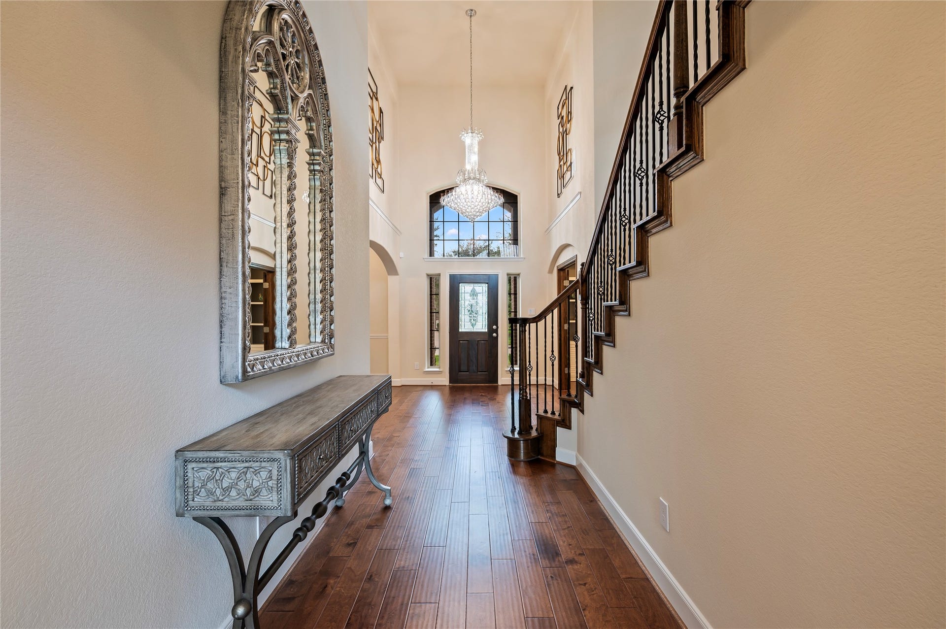 2322 Ashley Falls Lane, League City, TX 77573 Another view of the inviting entrance with neutral paint tones and art niches above the formal dining and private office.