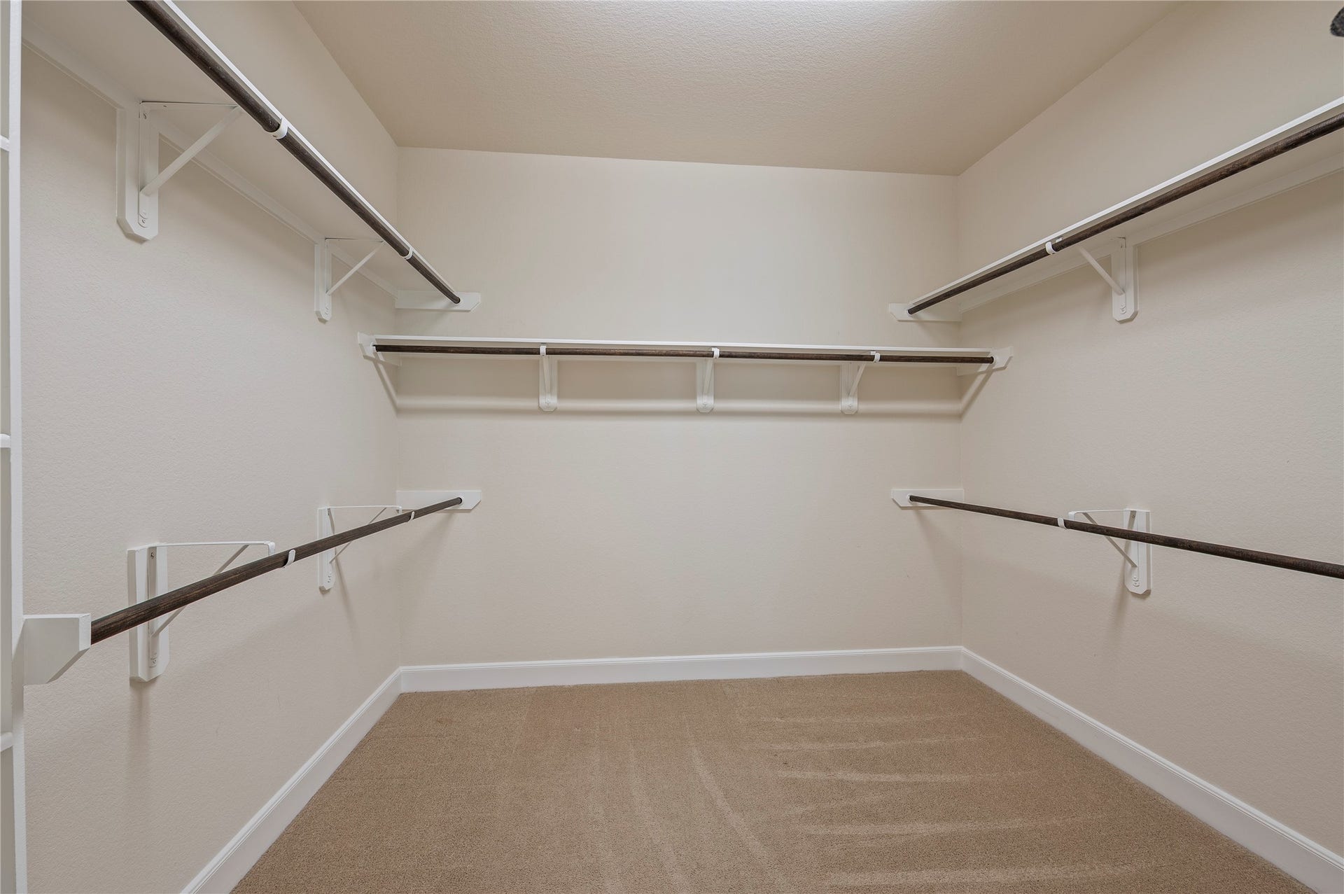 2322 Ashley Falls Lane, League City, TX 77573 His and hers walk-in closet with built-in storage.