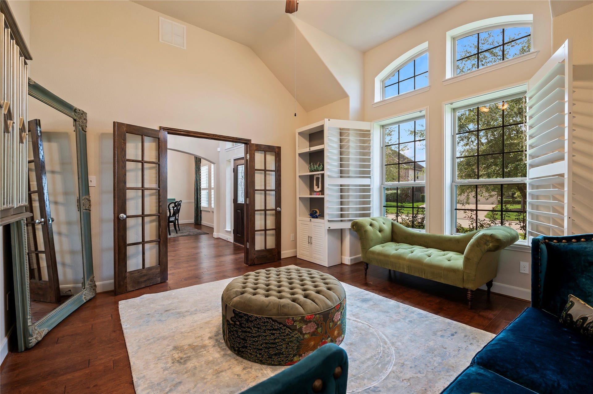 2322 Ashley Falls Lane, League City, TX 77573 Rich stained wood French doors introduce an elegant private home office with hardwood floors and plantation shutters.