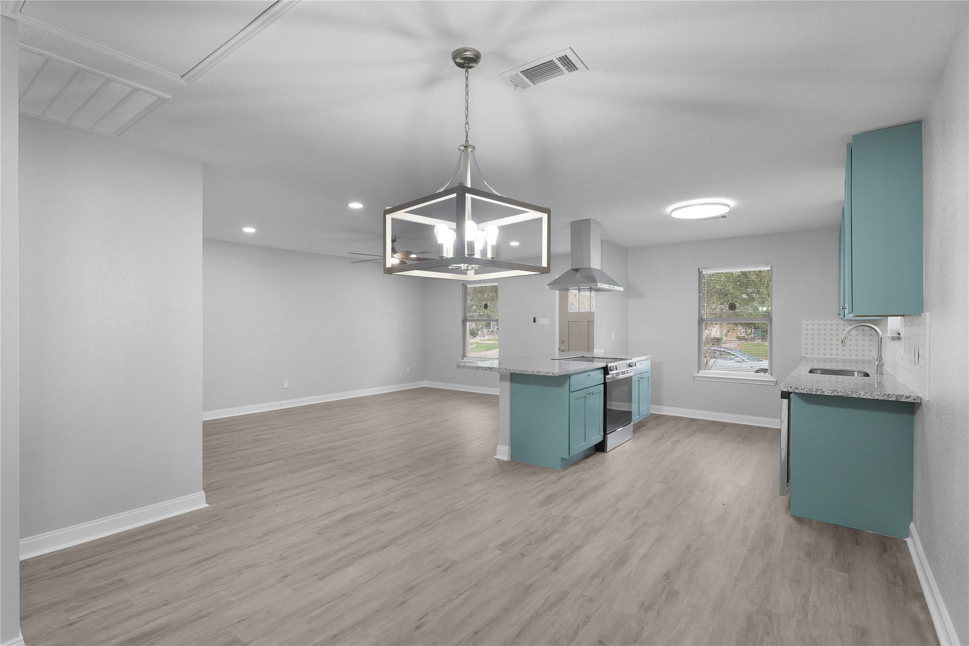 9827 Shive Drive, Houston, TX 77078 An open layout connects the dining area, living room, and kitchen, keeping everyday activities and gatherings together.