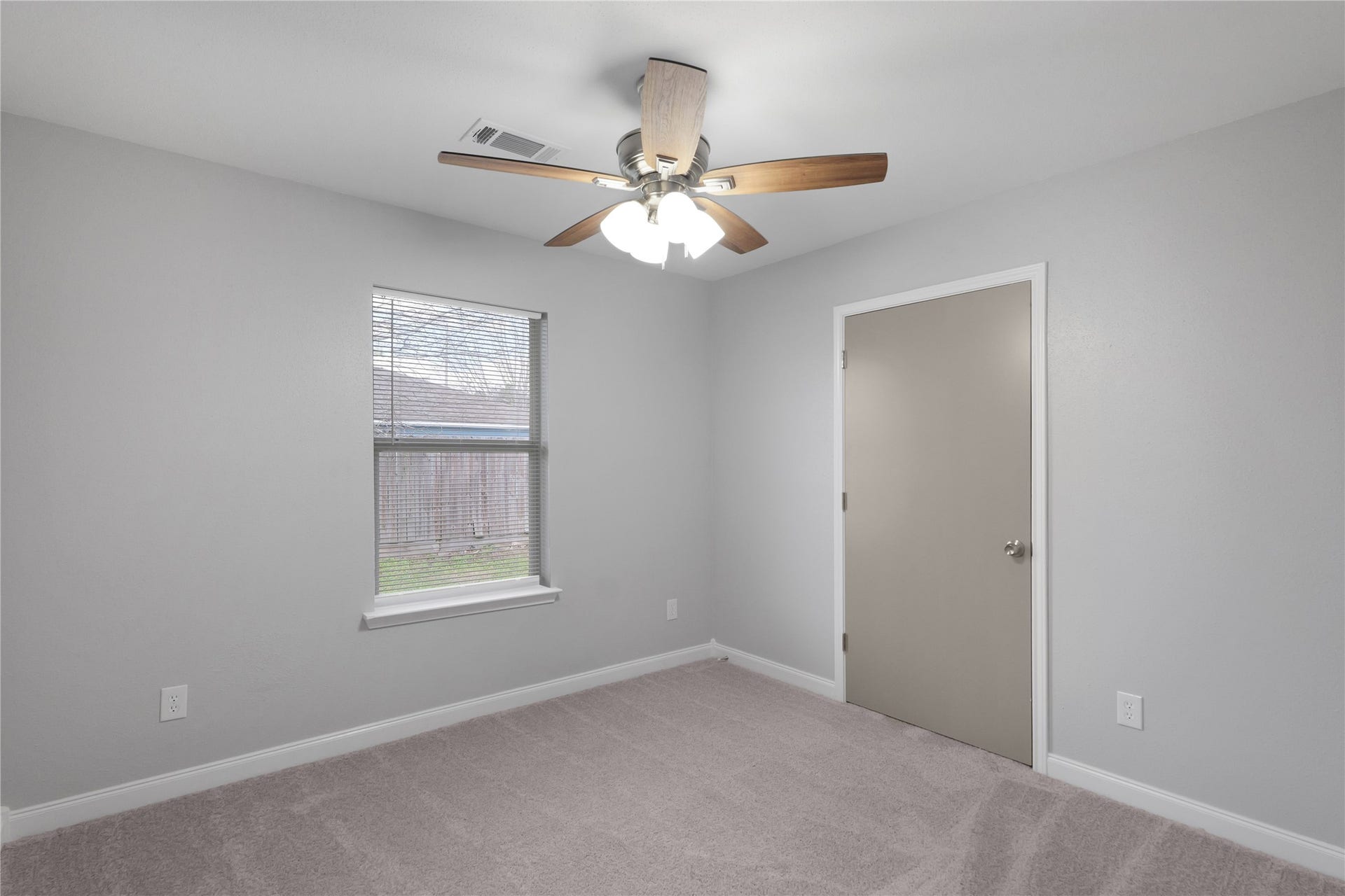 9827 Shive Drive, Houston, TX 77078 Natural light and neutral finishes provide a versatile backdrop in this secondary bedroom.