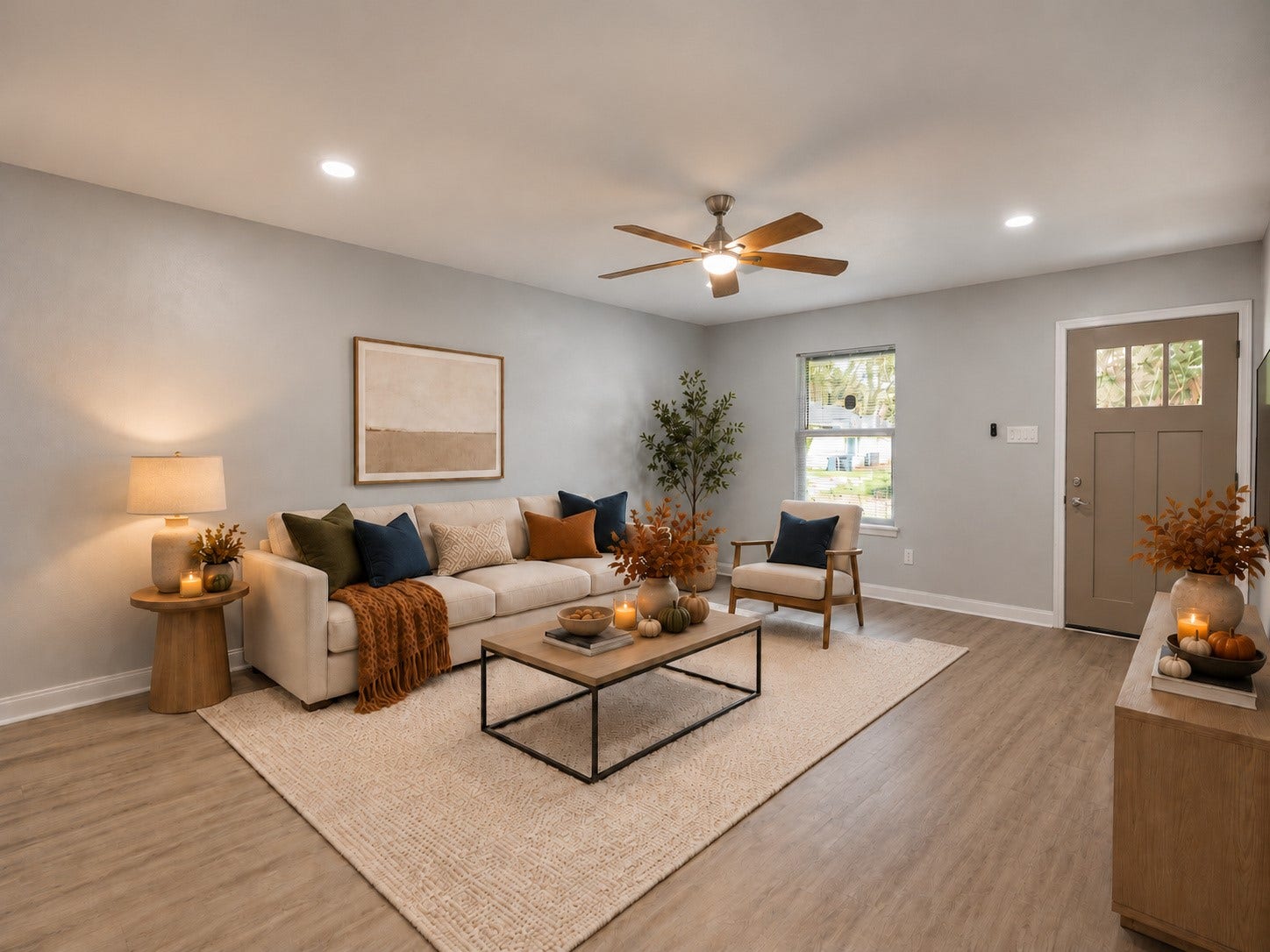 9827 Shive Drive, Houston, TX 77078 Living room featuring LVP flooring, recessed lighting, and a ceiling fan. Digitally staged.