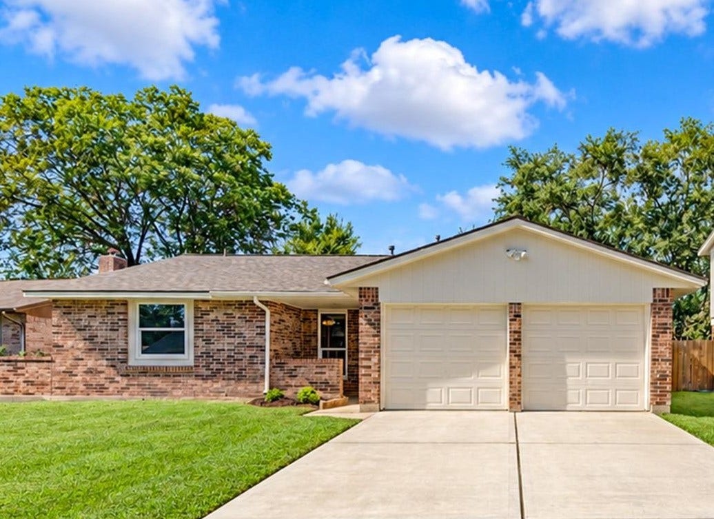 15106 Cypress Green Drive, Cypress, TX 77429 Beautiful curb appeal with fresh exterior paint and a spacious front lawn.