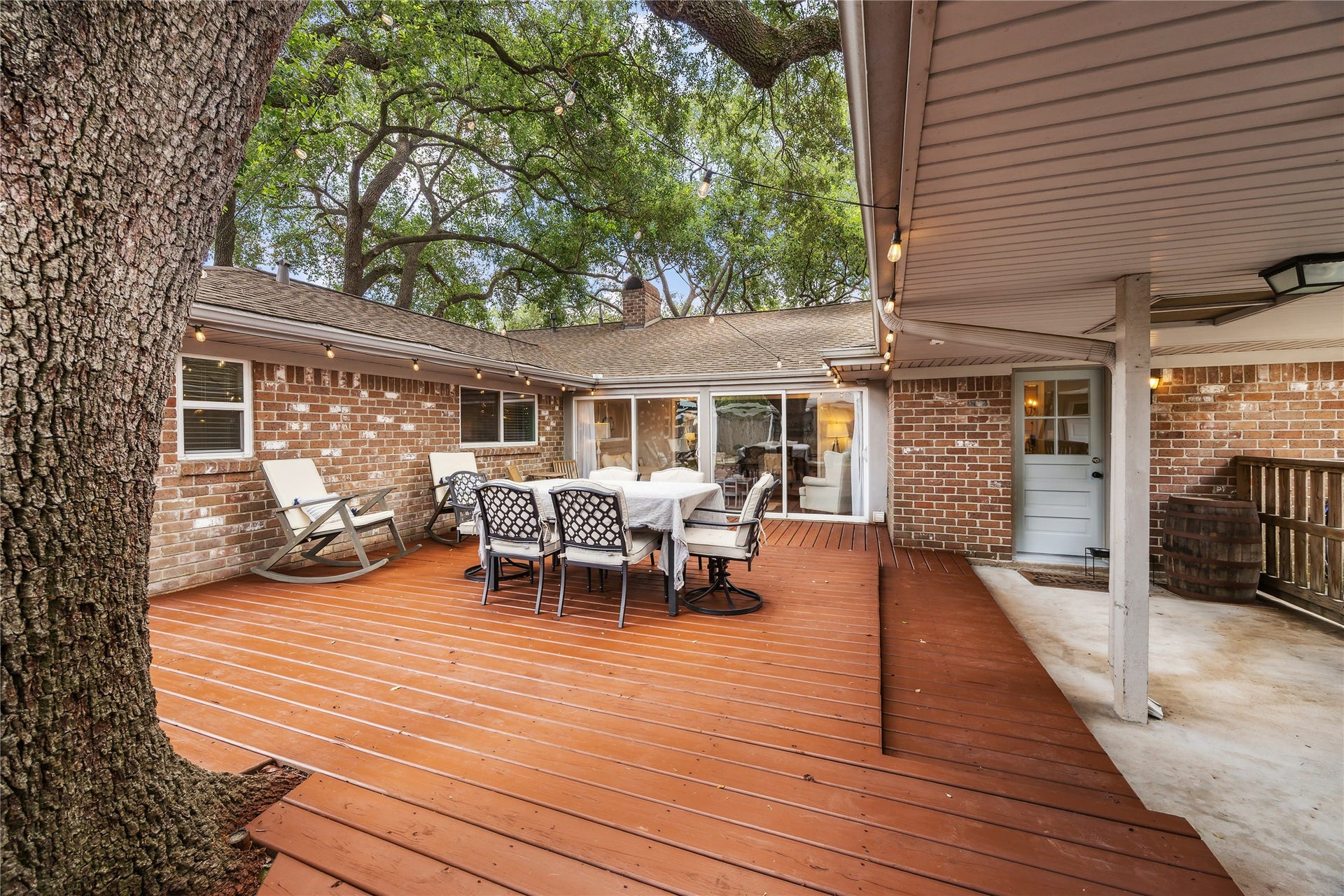 10714 Piping Rock Lane, Houston, TX 77042 This view highlights the expansive deck, shaded seating areas and adjoining covered walkway.