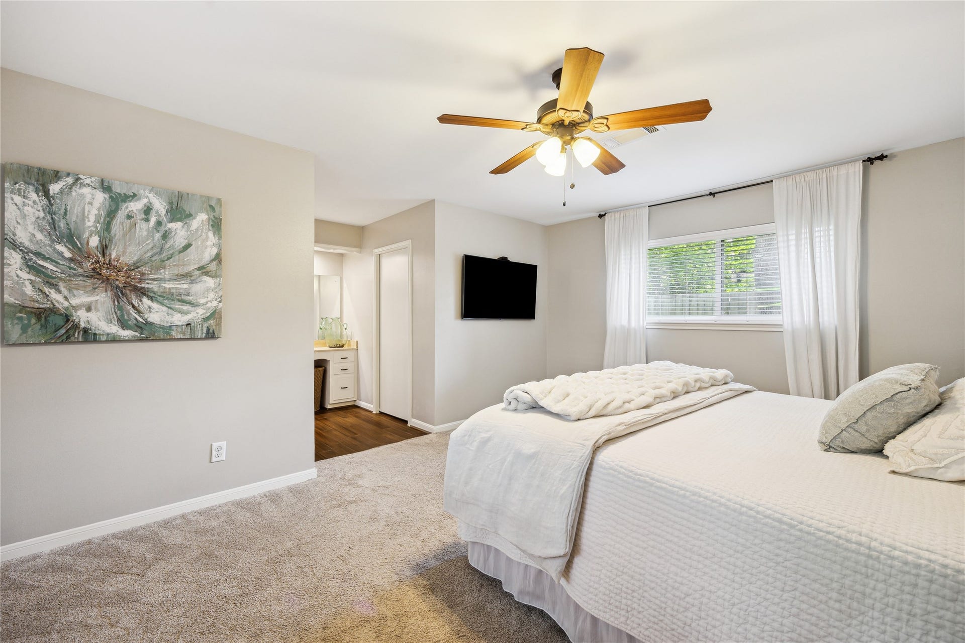 10714 Piping Rock Lane, Houston, TX 77042 This alternate view highlights the bedrooms generous layout and direct access to the adjoining vanity area.