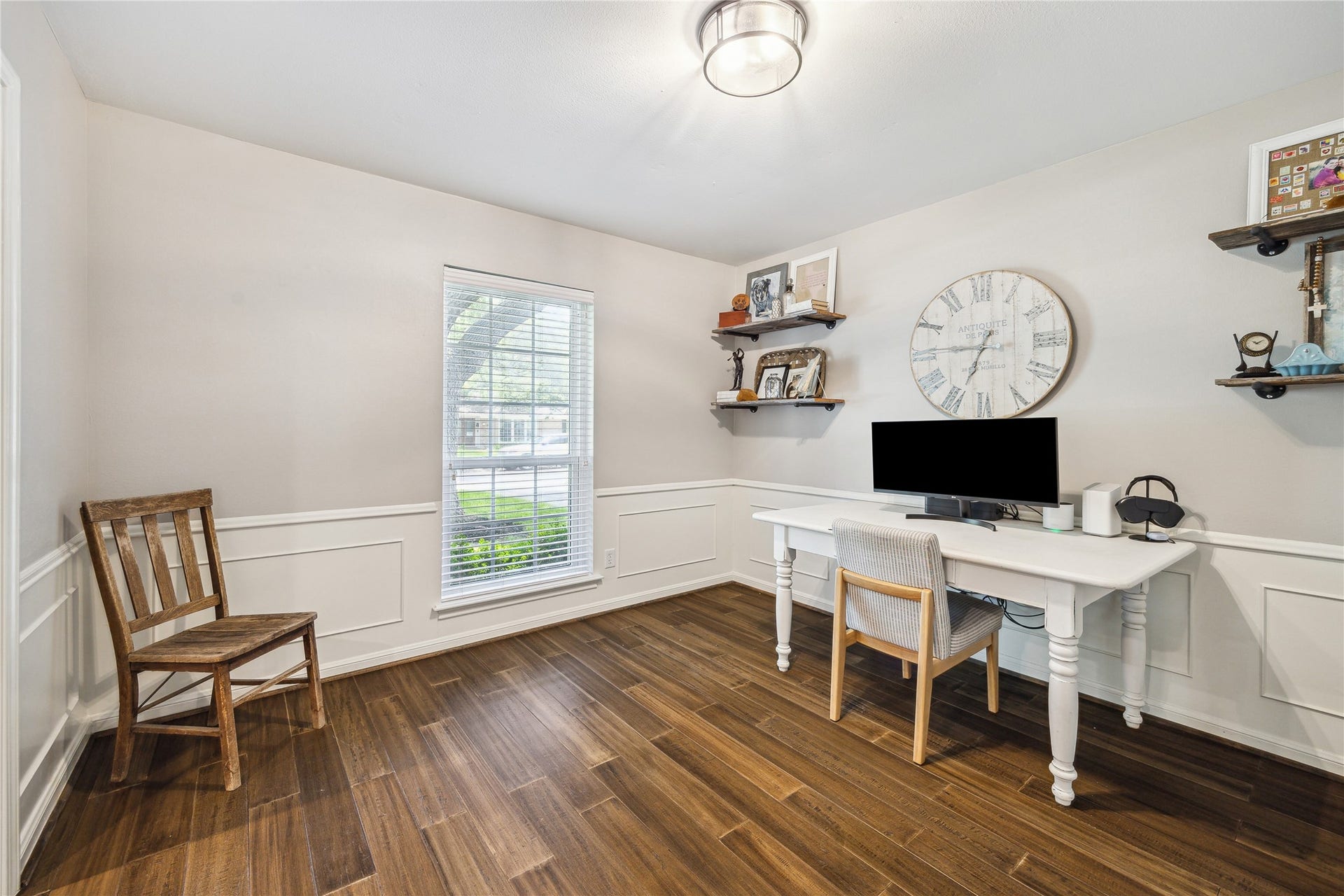 10714 Piping Rock Lane, Houston, TX 77042 Currently arranged as an office, this room features wood flooring, decorative wall trim and a window overlooking the outdoors.
