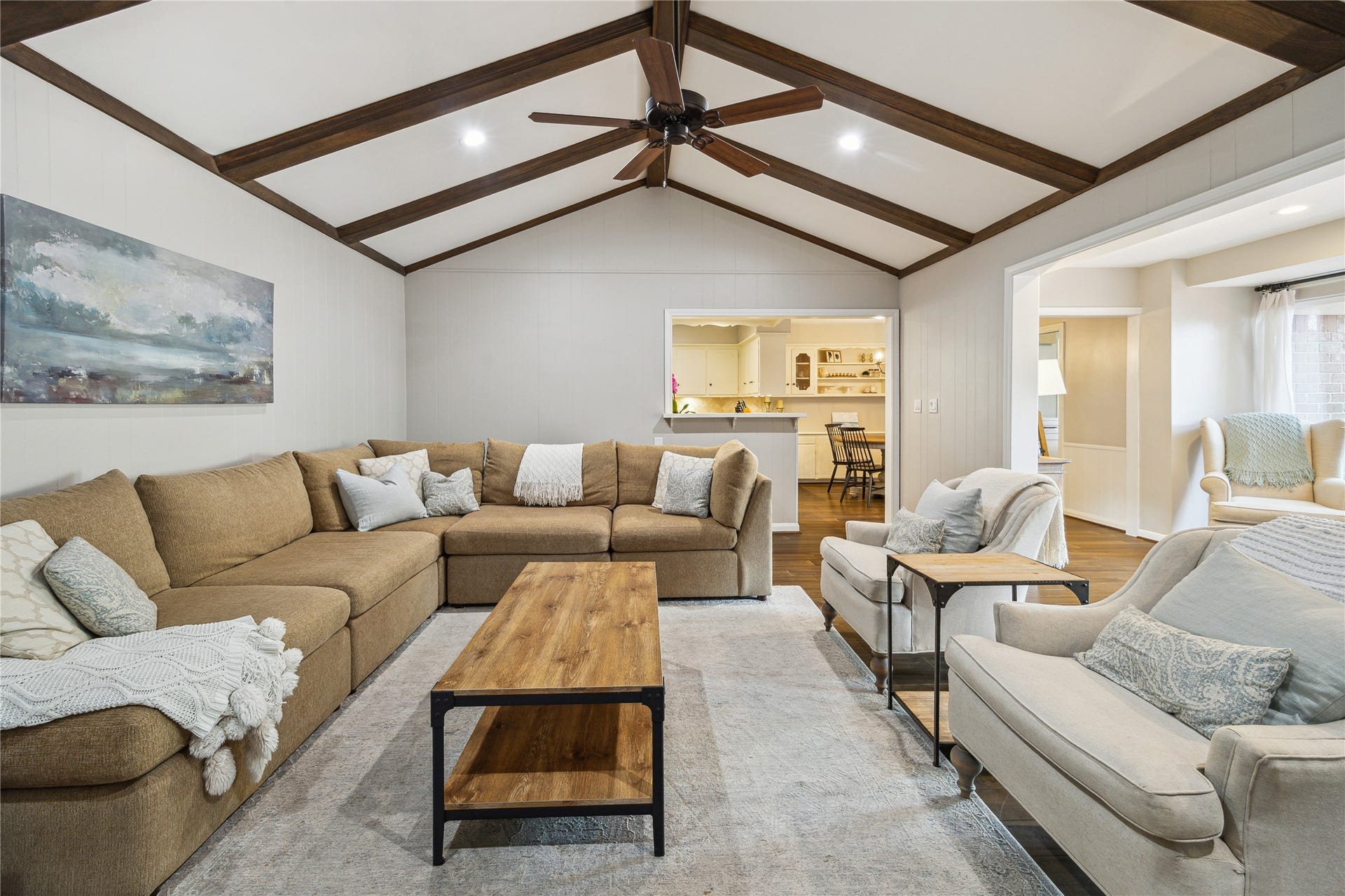 10714 Piping Rock Lane, Houston, TX 77042 This view highlights the vaulted ceiling, generous seating space and breakfast bar connecting the living room to the kitchen.