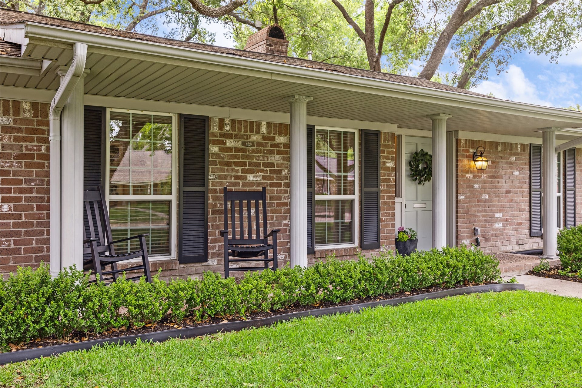 10714 Piping Rock Lane, Houston, TX 77042 The covered front porch offers space for rocking chairs and a shaded spot to enjoy the outdoors.