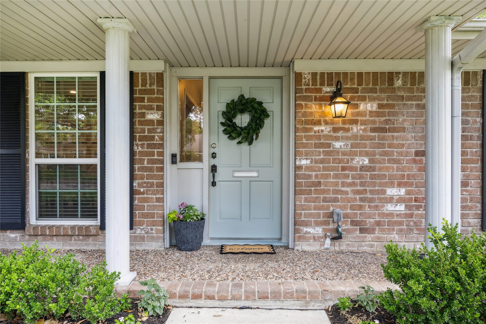 10714 Piping Rock Lane, Houston, TX 77042 A soft green front door, decorative sidelights and brick accents welcome you home.