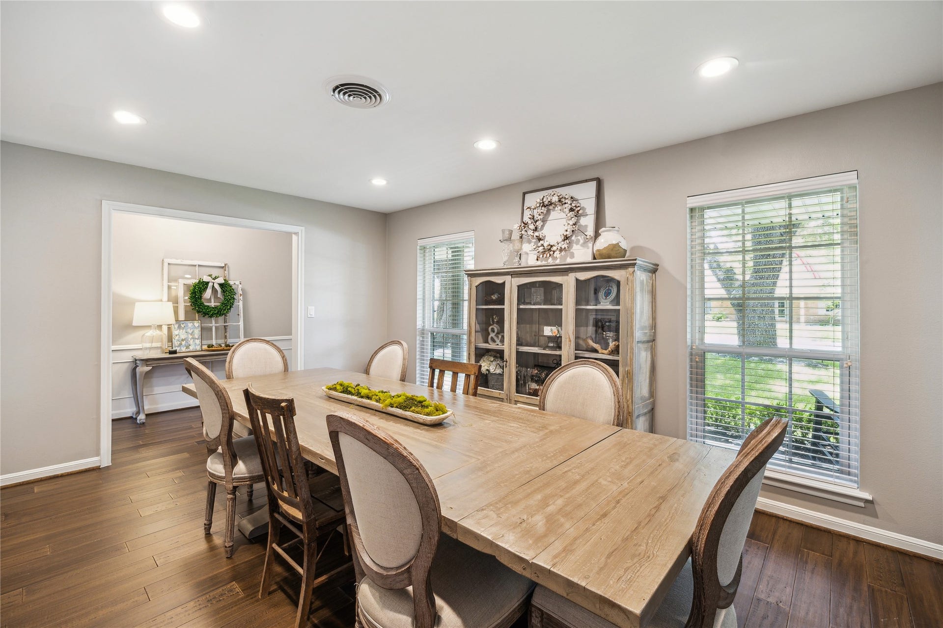 10714 Piping Rock Lane, Houston, TX 77042 A large window brings natural light into the dining room, complementing its neutral palette and classic trim.