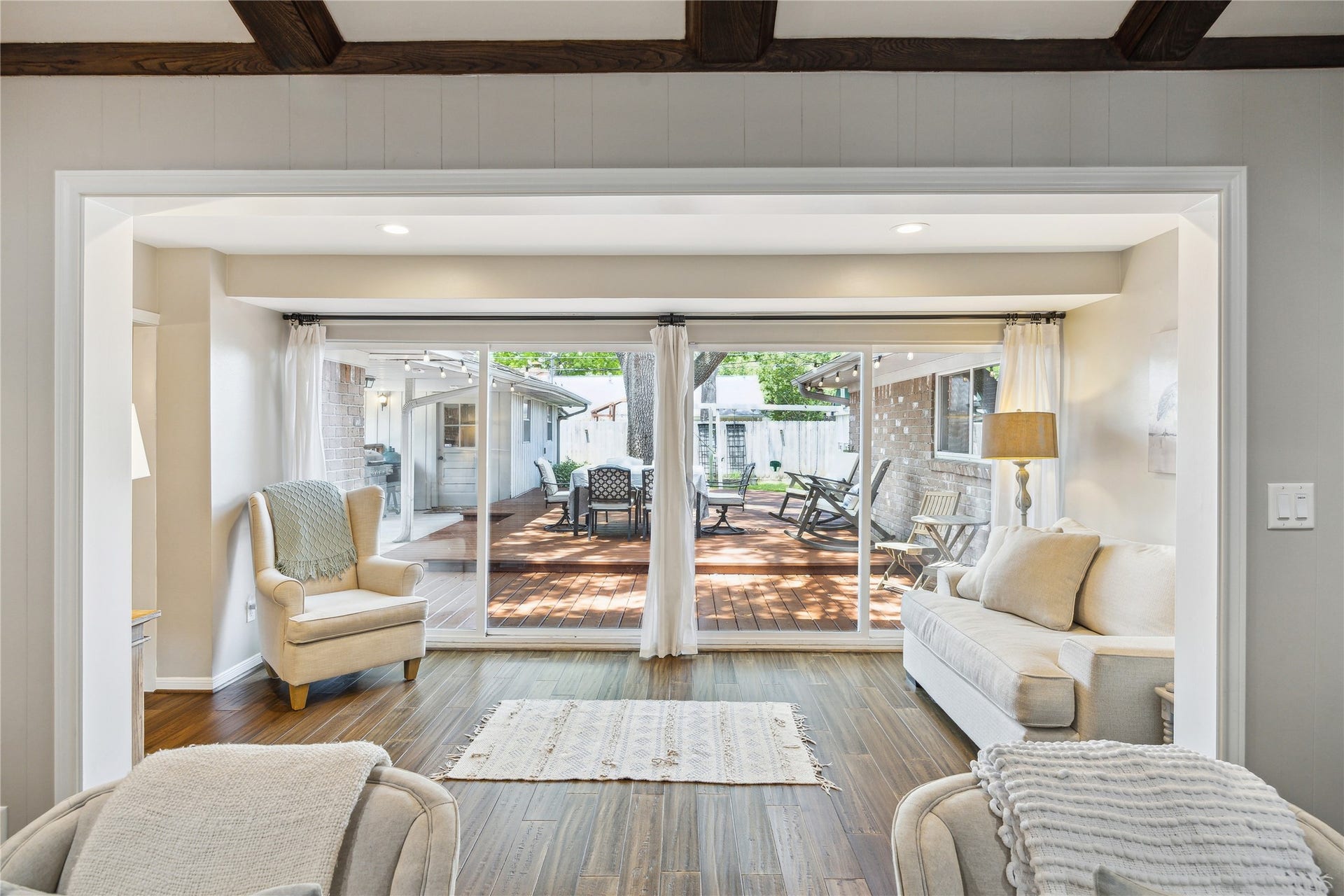 10714 Piping Rock Lane, Houston, TX 77042 Just beyond the living room, a bright sitting area overlooks the backyard deck through expansive glass doors.